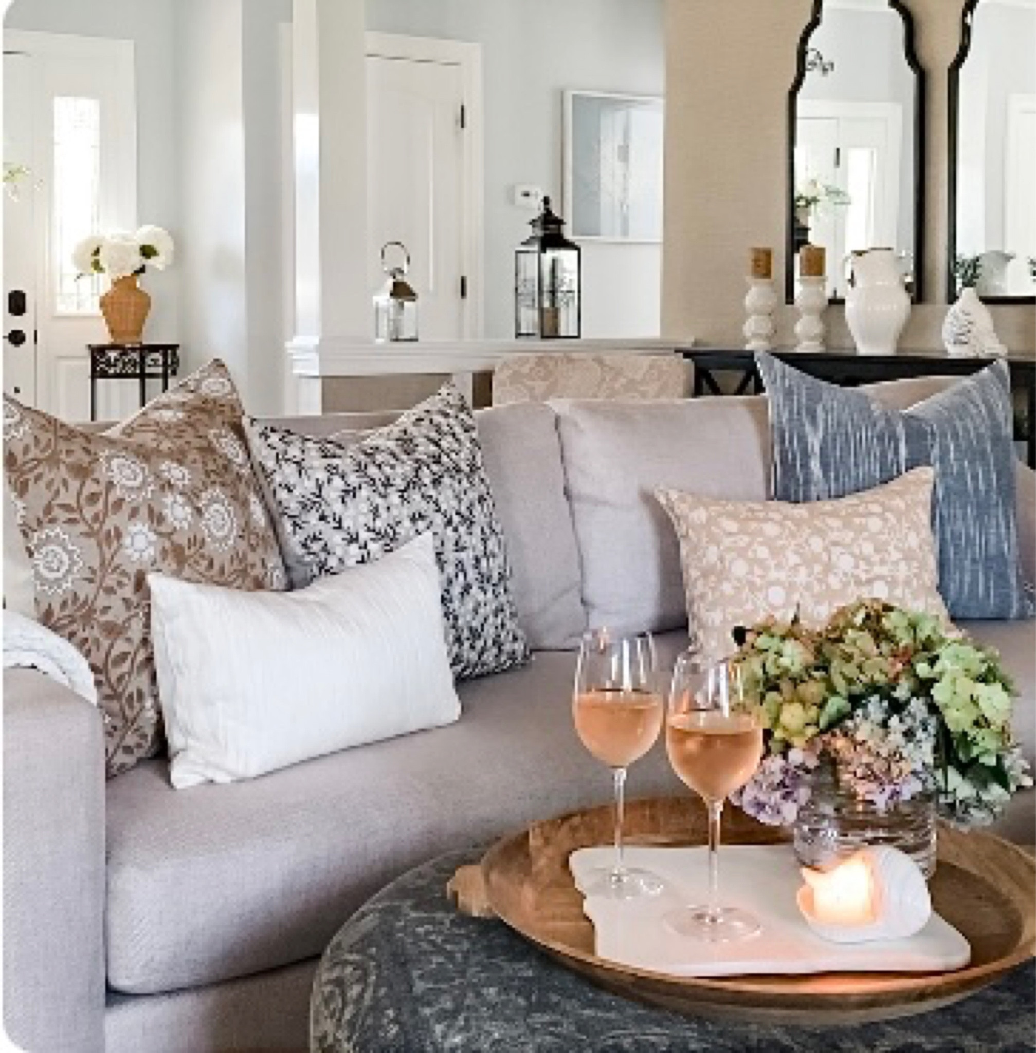 Spring styling. Neutral, modern coastal living room styling. York sofa from Pottery Barn. Neutral and blue floral pattern pillow covers, blue stripe pillow cover, off white pillow. Best selling round wood tray, marble scallop board, , fragrant Diptyque candle, Rattan vase, white wine glasses. Pottery Barn, Target, Etsy, Krinto, Williams Sonoma, Diptyque, Walmart. Home decor accessories. Coastal, classic, modern farmhouse, traditional, transitional home decor style. 

#LTKstyletip #LTKhome #LTKunder50