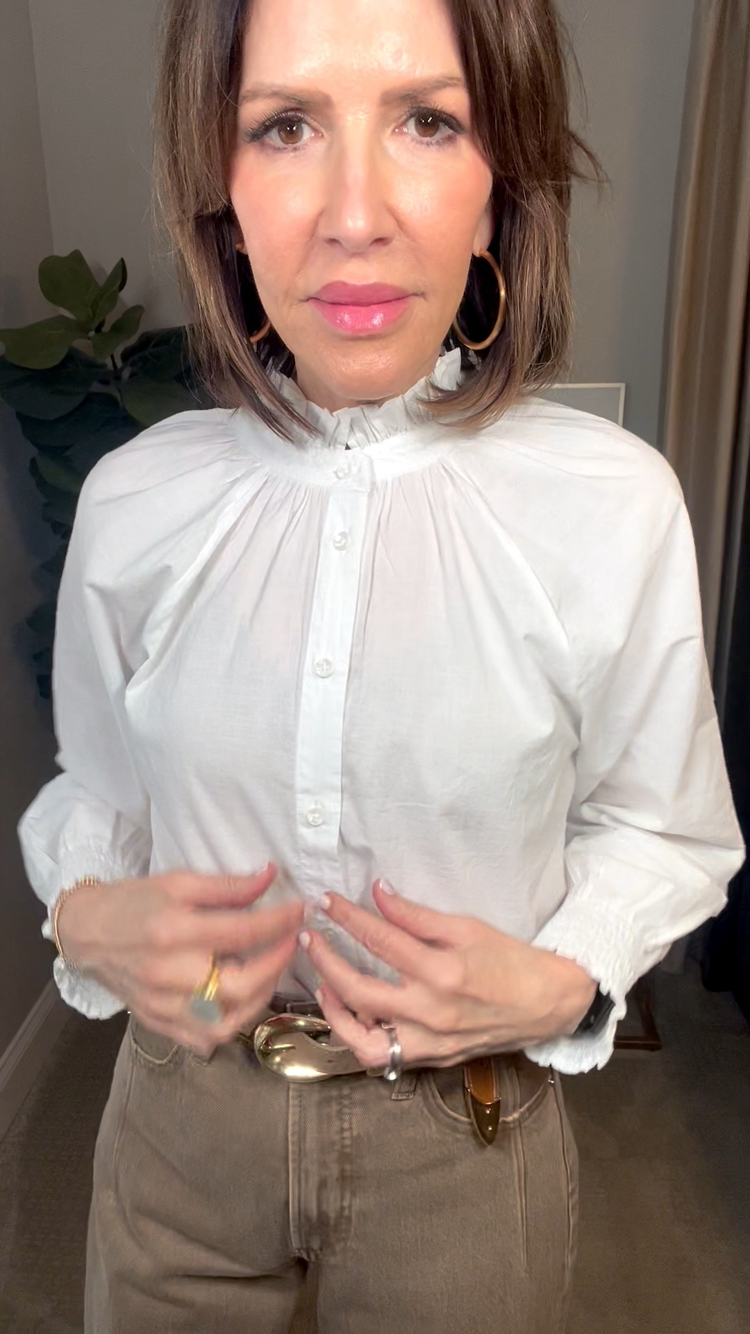 white ruffle neck top, gold hoop earrings, tan wide leg jeans, tan suede belt, over 50 outfits, neutral outfit 

#LTKOver40 #LTKSeasonal #LTKootd