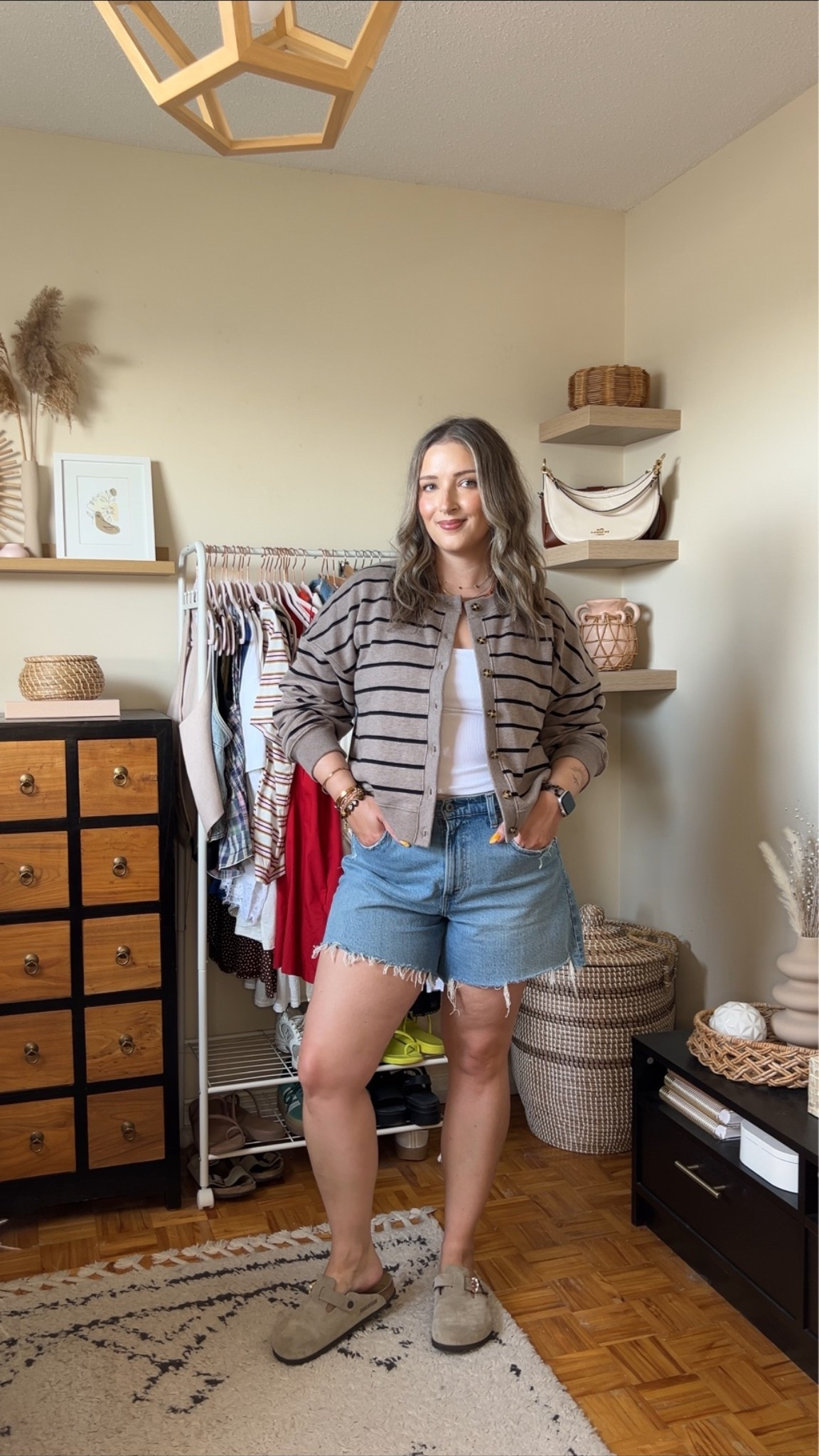 Abercrombie summer to fall transitional outfit! Wearing size L in the striped cardigan sweatshirt and size M in the bra free tank. Sized up to 32 in the denim shorts for a baggy fit. I’m a 9.5-10 shoe and wear a 40 in the Birkenstocks

#LTKfall #LTKmidsize #LTKsummer