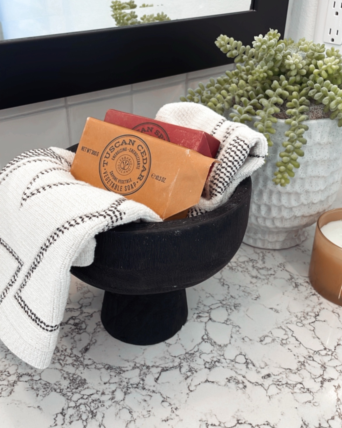 This bathroom counter styling combo is one of my favorite ways to make a bathroom feel intentional and pulled together. 

A pedestal bowl instantly adds height and interest, while folded hand towels and artisan soaps bring in texture and that spa-like, collected feel.

I love using this setup on bathroom vanities, powder room counters, and guest bathrooms—it keeps everyday essentials within reach while still looking styled. 

Neutral towels, handcrafted soap, and a simple bowl are small details that make a big impact.

If your bathroom feels unfinished, thoughtful countertop decor like this can completely elevate the space without a full remodel.

✨ Shop the bathroom counter styling pieces linked here.

#LTKHome #LTKdayinmylife #LTKGiftGuide
