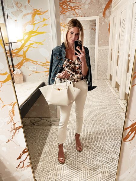 Similar floral top, denim jacket, flattering white jeans, similar heels and similar purse.

#LTKstyletip #LTKSeasonal #LTKFind