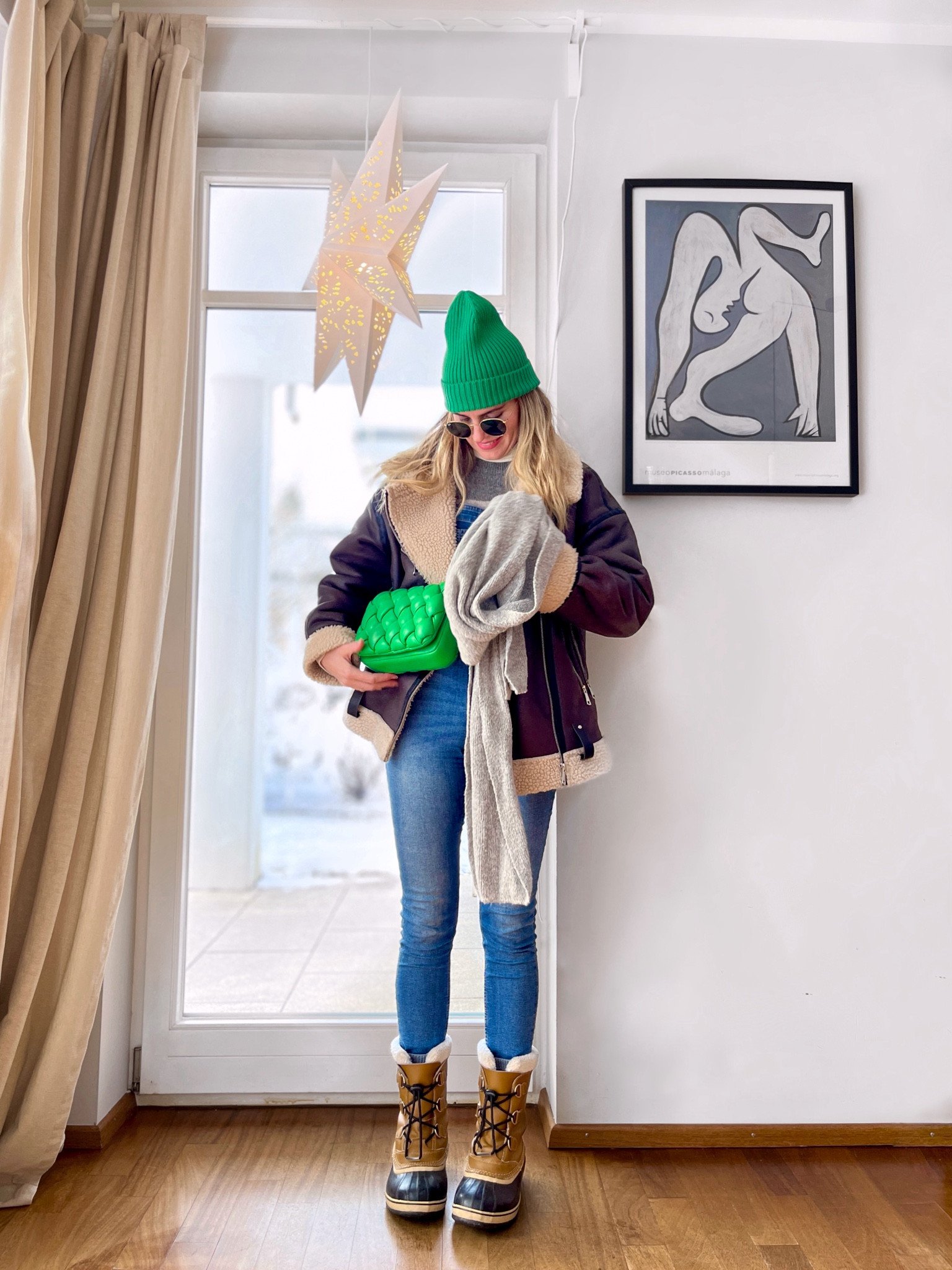 Blonde girl in daily street style wearing color. #pilotjacket #winterjacket #greenoutfit #colorfuloutfit #colorfulstyle #colorfulfashion #colorfullooks #fashionfun #cutewinteroutfit #winterfashion2023 #winterlookbook #fitcheck #dailylooks #dailylookbook #contentcreator #microinfluencer #discoverunder20k