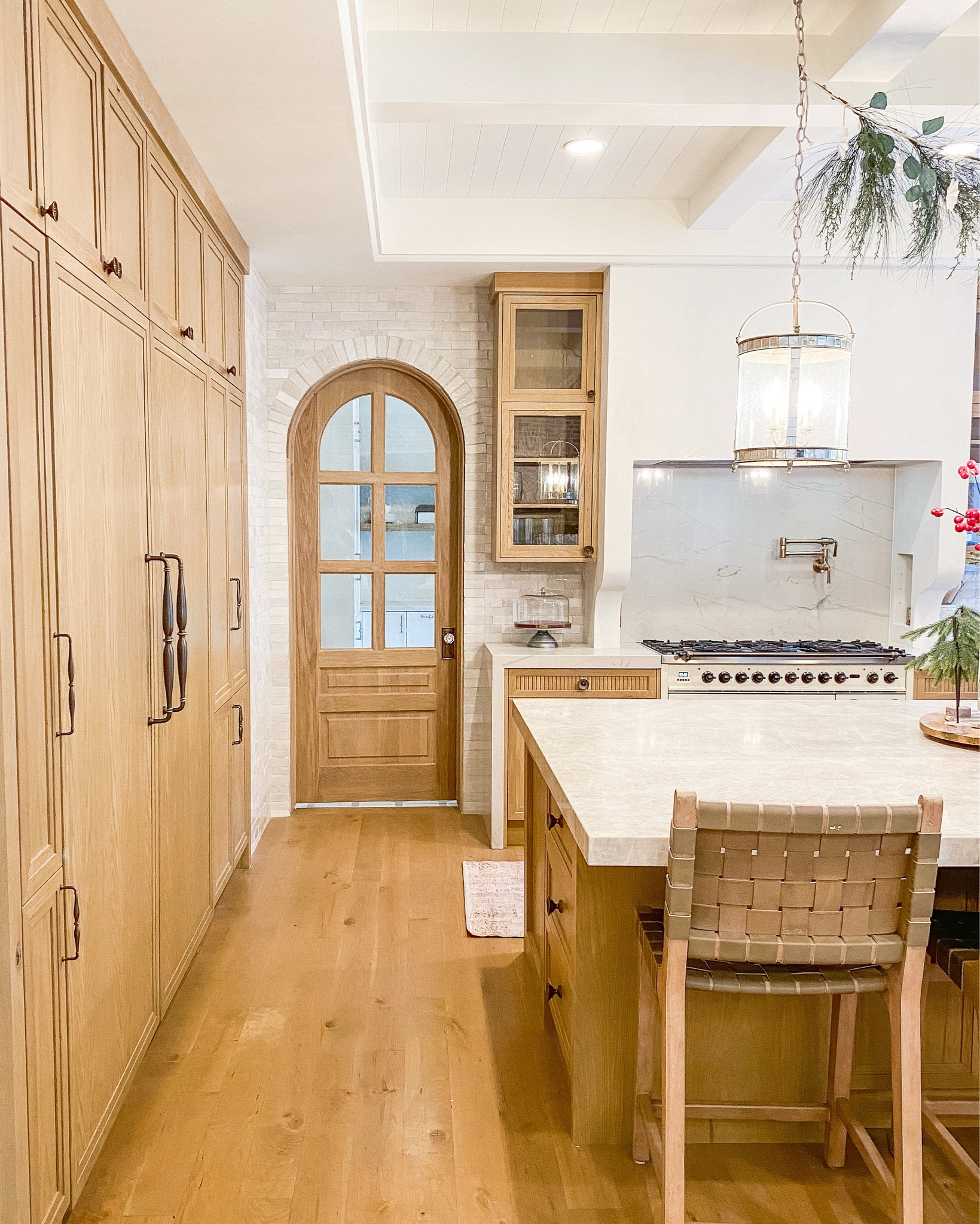Want a kitchen that feels warm and collected? Wood cabinetry, glass lighting and woven seating are a beautiful place to start 🤎 Adam built the cabinetry in this client’s home. For a different take on this warm palette, I’ve linked a brass pendant and pot-filler option, plus a vase I’d add to the counter. These are suggested additions and alternatives, not the exact pieces pictured. Shop the tagged picks and check measurements before ordering.

#LTKHome