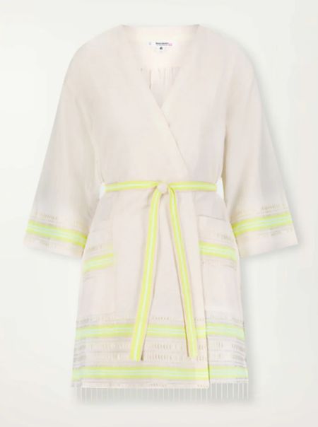 IMANI | Robe 

The Lomi Keylime Collection features combination of matte and shine natural tibebs and stripes in Vanilla Cream and Lime sorbet colors.

This versatile short robe features an interior waist tie for a secured and adjustable fit. Added details like wide sleeves, pockets, a tiered ruffle and side slits add extra glamor to this everyday wardrobe staple.
Hand-woven in Ethiopia, this silhouette is made of soft hand-spun cotton for a light and comfortable feel.

#LTKtravel #LTKstyletip #LTKswim
