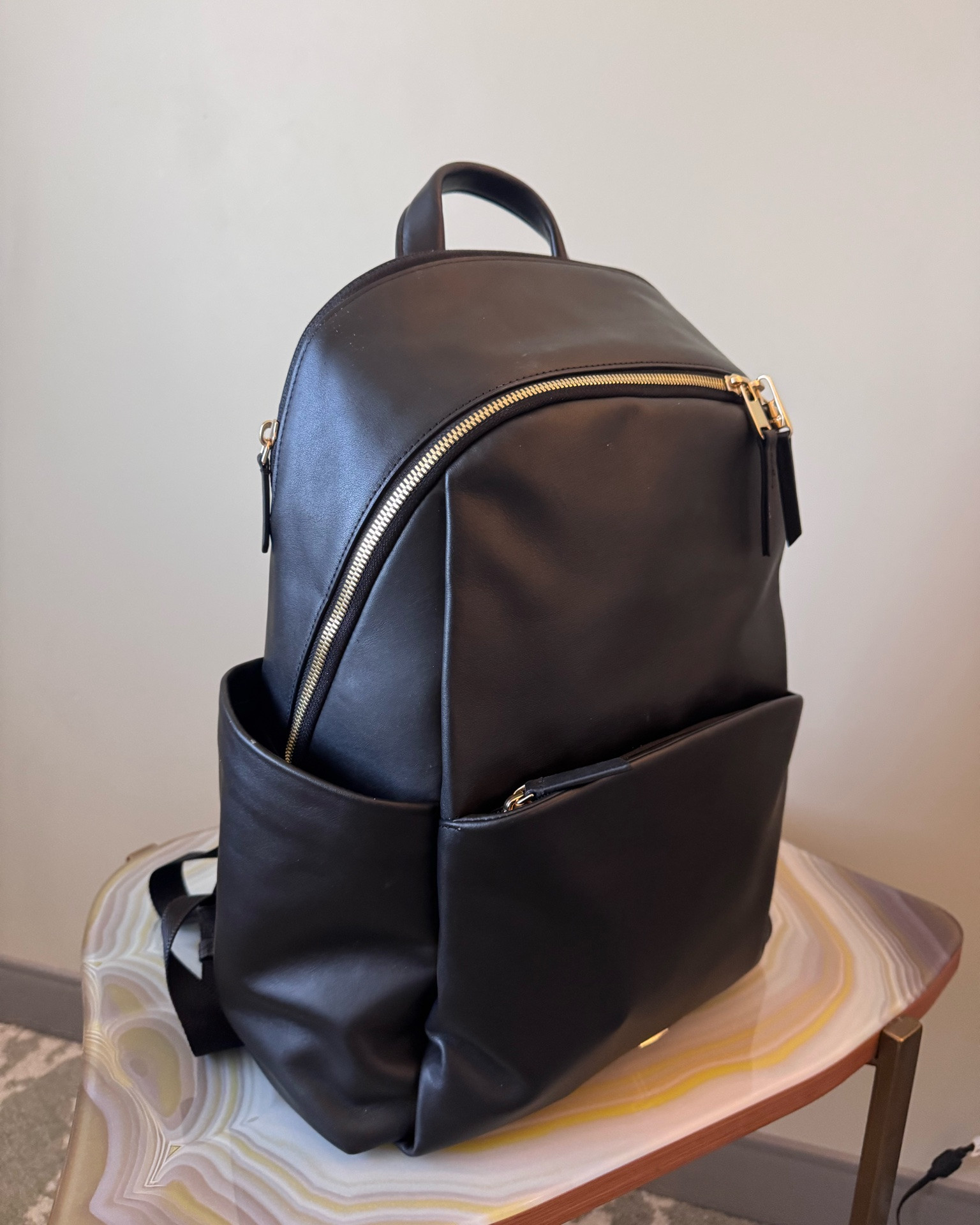 Black leather large backpack | holds water bottles | gold hardware | work bag | Tumi

#LTKWorkwear #LTKTravel #LTKPetite