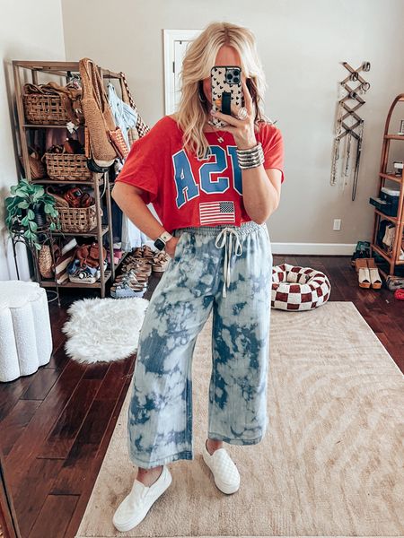 This mens USA tee is so cute! I sized up to an XL for the oversized fit. I also cut the sleeves, length and neck out for this fun look! ✂️ 
These pants are from @threebirdnest. Save with code MANDIE (I can’t link here but you can copy & paste this link 👉🏼 https://collabs.shop/yxhqqt
USA style, summer style, red white and blue style 

#LTKOver40 #LTKFindsUnder50 #LTKStyleTip