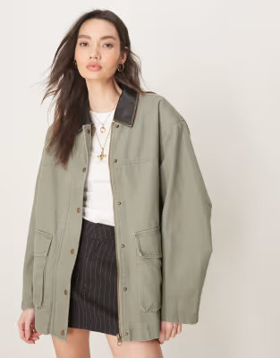 ASOS DESIGN oversized washed barn jacket with leather look collar in khaki | ASOS (Global)