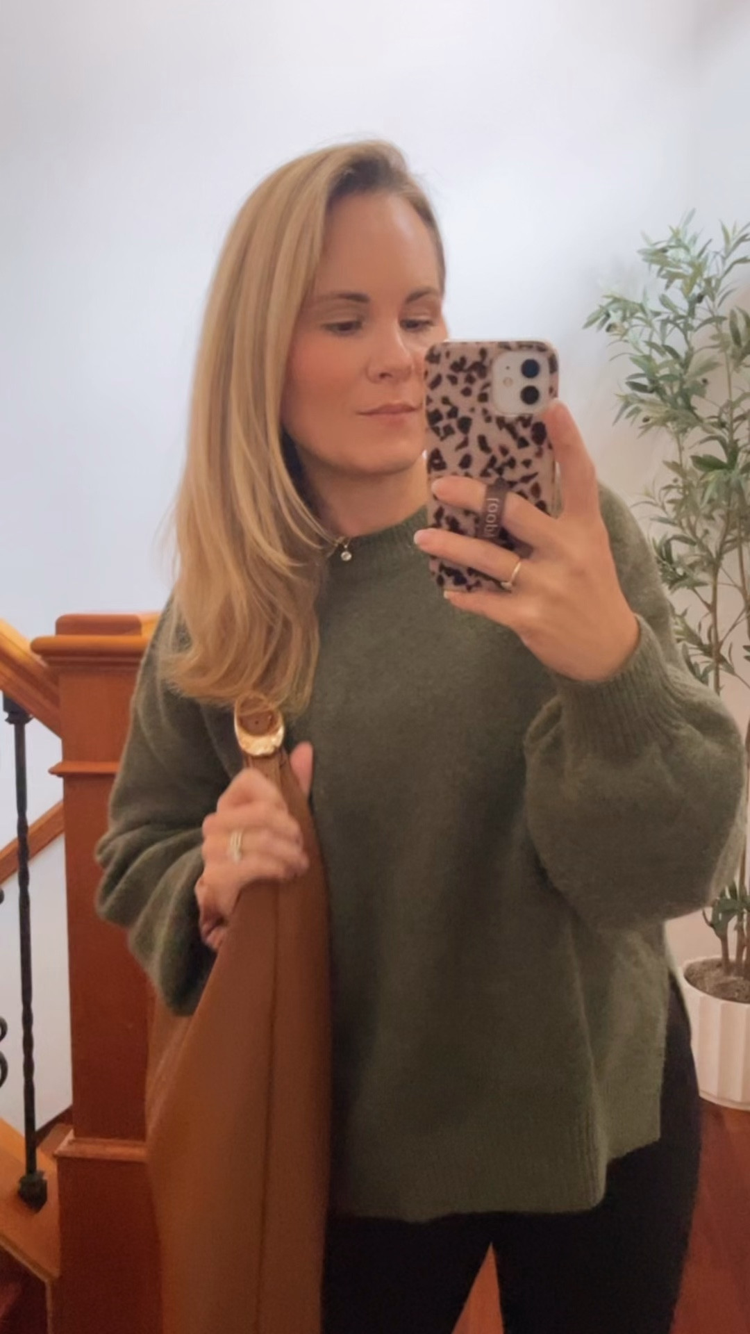 Pairing a sweater with leggings because I’ve been wearing sweatshirts nonstop with leggings and I wanted to do something a bit more dressed up so putting on this green sweater with my leggings and then this cute little anthropology bag as well ￼

#LTKspringtrends #LTKspring #LTKhaul