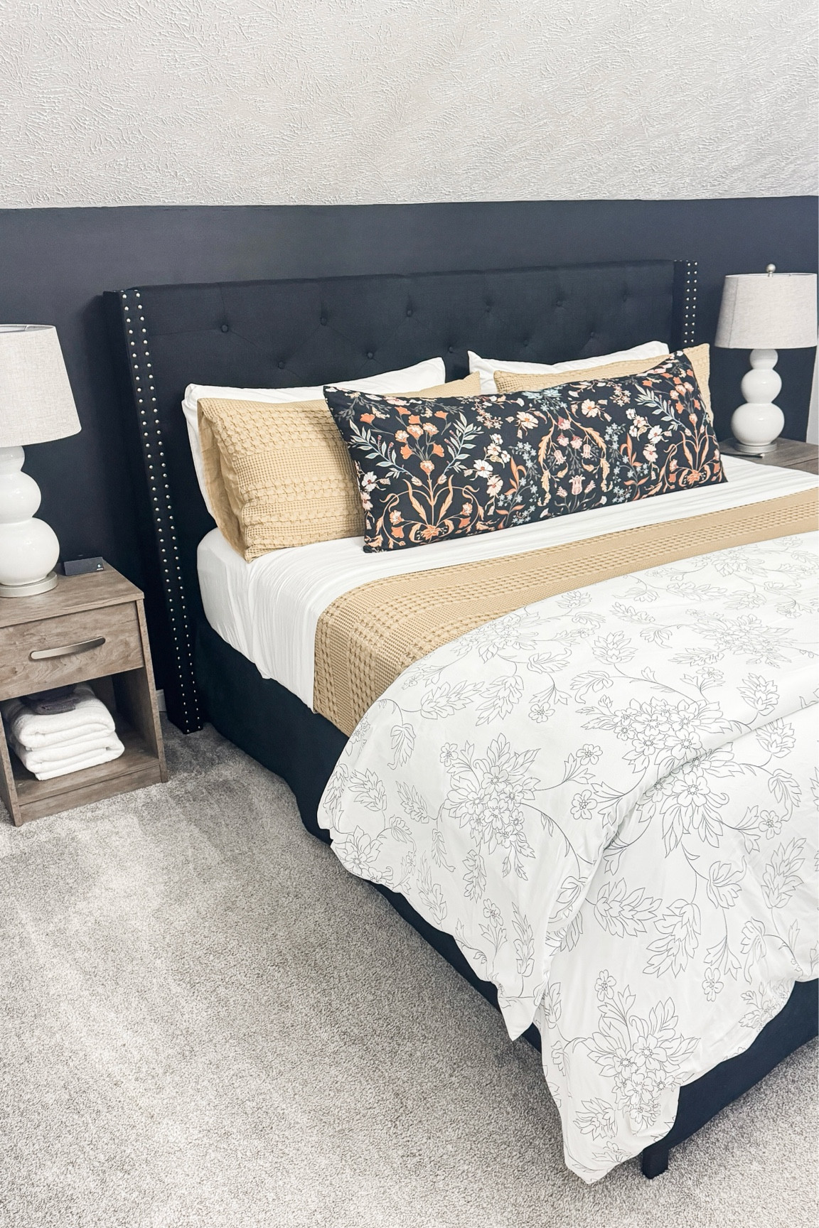 King bed bedroom Airbnb rental master bedroom decor. Black accent wall. 

#LTKhome #LTKstyletip #LTKfindsunder100