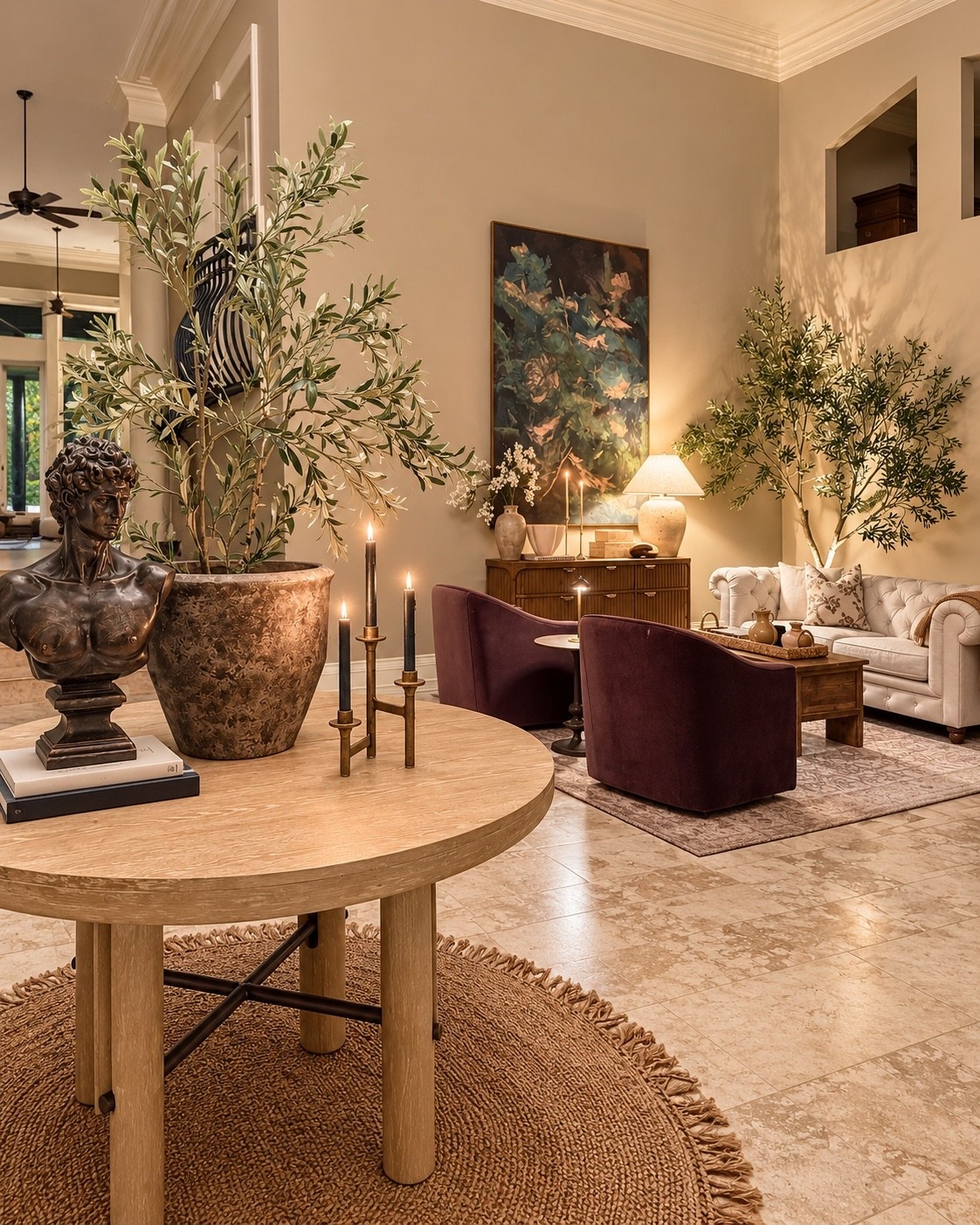 Moody, collected, and layered 🤎 This room is all about mixing warm wood, soft neutrals, deep plum, oversized greenery, sculptural accents, and ambient lighting to create a space that feels elevated but still comfortable. Linking the pieces and similar finds to recreate the look.

#LTKHome #LTKFinds #InteriorDesign #HomeDecor #CollectedHome #MoodyInteriors
