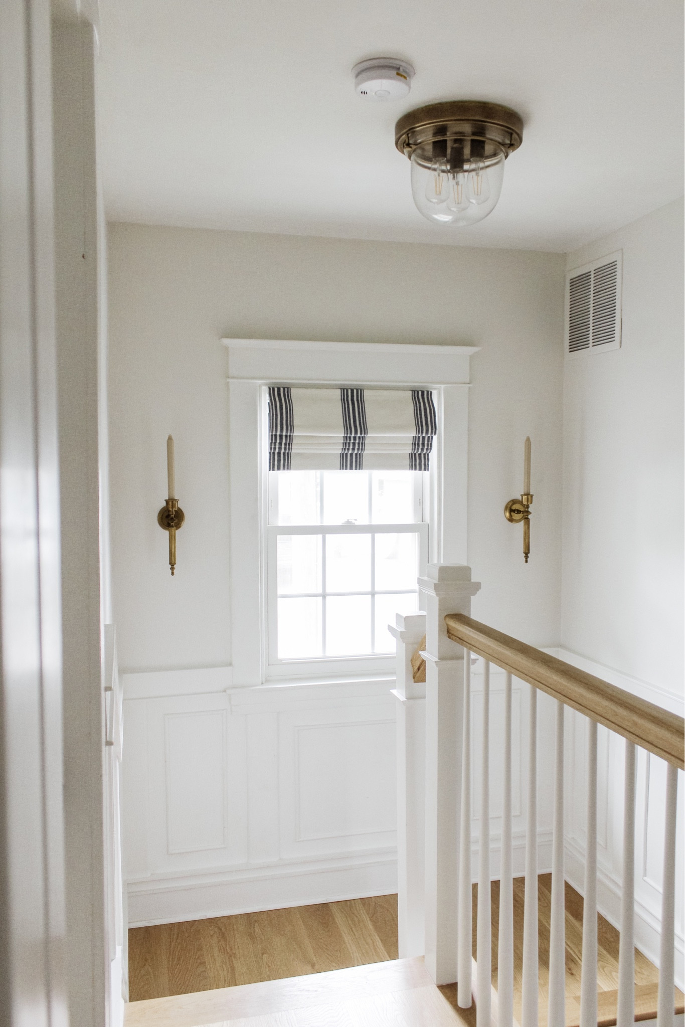 An instant gratification project for ya 😉 Lighting in here is tough but I hope you can see how taking an extra step with window treatments and sconces can add more to a space! Shop the shades & similar vintage candle sconces on @megleonardco via LTK from the link in bio!
•
•
•
Stripe Roman shades, vintage candle holders, hallway decor, neutral home 

#LTKhome #LTKfindsunder50 #LTKstyletip