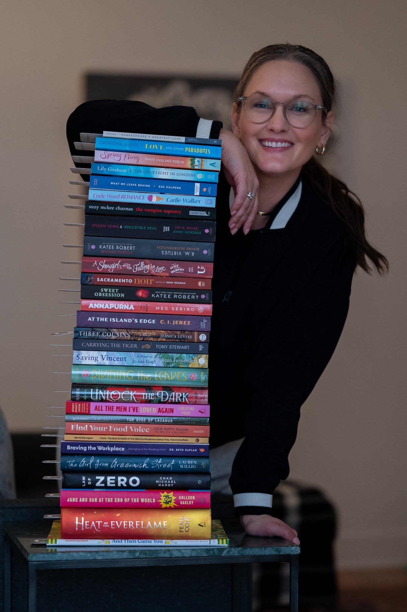 Wrapped in the effortless cool of a black and white varsity bomber jacket layered over a cropped black tee, she feels like she’s stepped straight out of the pages of her own story. Her wide-leg jeans give just the right amount of ease, a balance of structure and movement, while gold hoop earrings add a touch of timeless confidence. A fresh stack of book mail waits, each package a promise of new adventures, new voices, new ideas. As she flips through the covers, the crisp air of March fades into the softer warmth of April, a shift in seasons that mirrors the anticipation buzzing beneath her skin. In this moment, she is the main character—bold, curious, and ready for whatever comes next.

#LTKStyleTip #LTKFamily #LTKHome