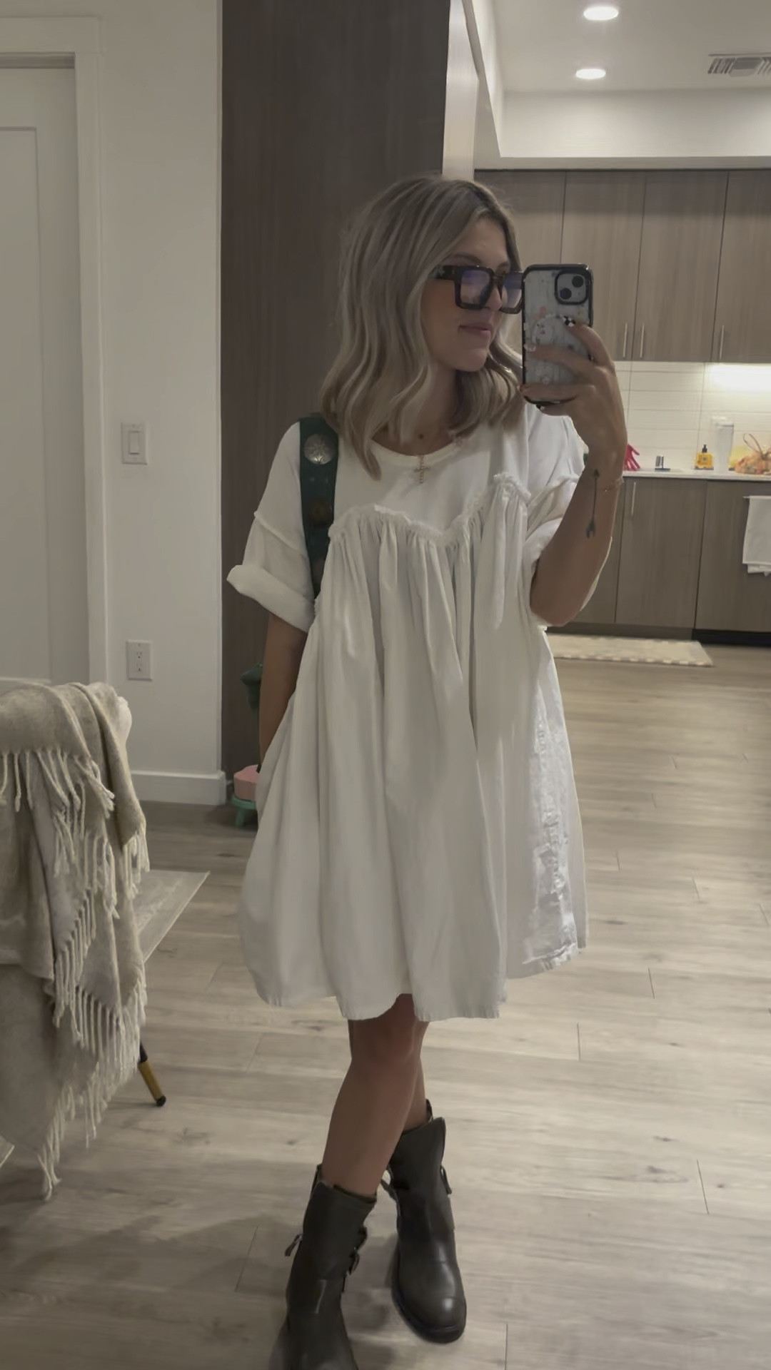 White dress paired with green combat styled boots and a free people belt bag 

#LTKWorkwear #LTKShoeCrush #LTKStyleTip