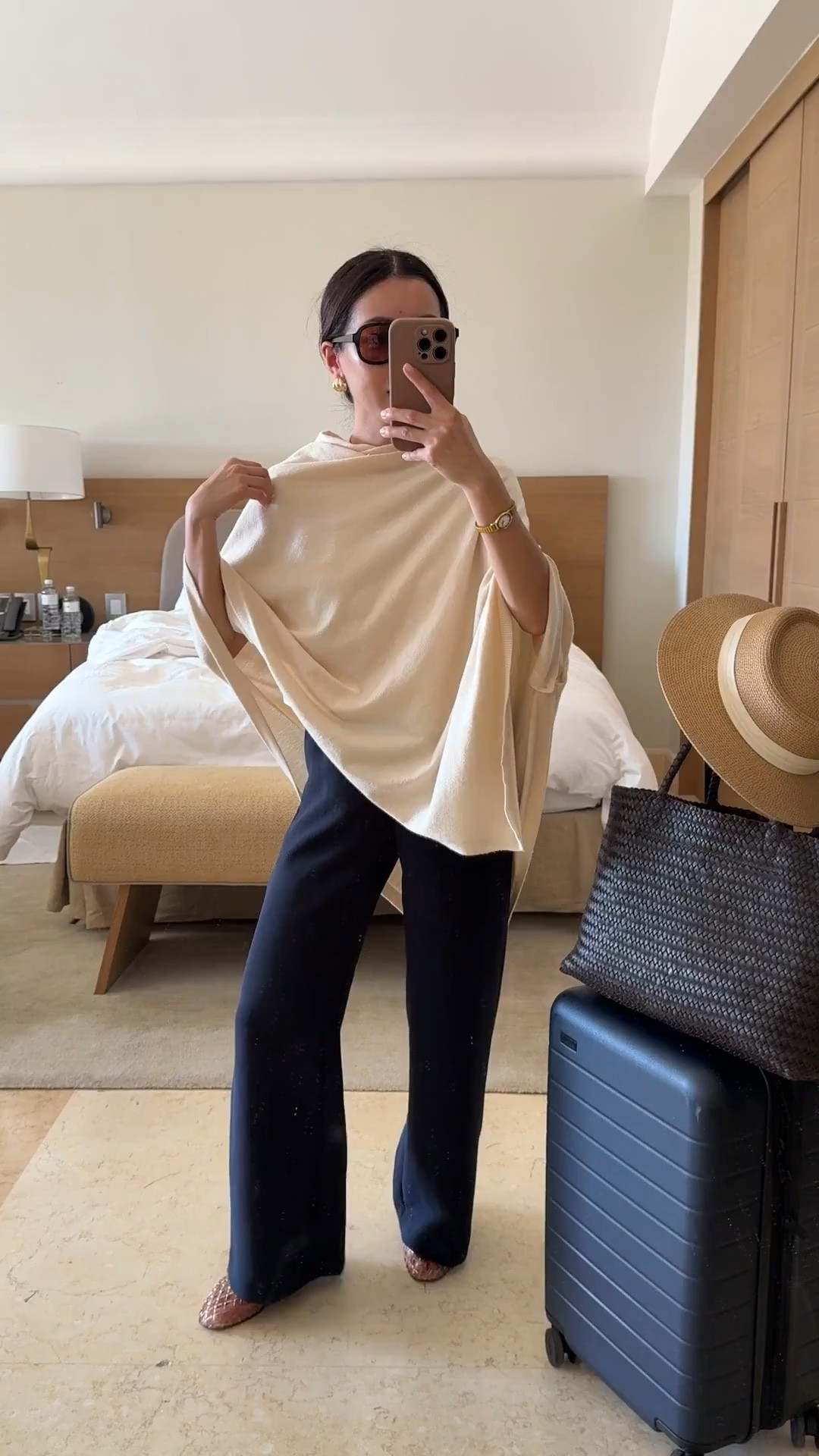 Sizing below! Comfy Travel outfit 
• lodge trousers 2XS short, these are amazing! Drapey fluid fabric that isn’t thin, stretch waist, wrinkle resistant

• Amazon convertible poncho sweater wrap

• lululemon cropped boxy cut t-shirt size xxxs (could also do XXS) nice medium-weight cotton, softly structured and perfect petite friendly length

• Dolce Vita jelly flats in Mocha size 5, size down if you're a half size

• Madewell woven leather tote - My favorite work / mom / travel bag that fits my laptop and much more

• Madewell aviator sunglasses

• Amazon packable sunhat with an adjustable inner fit. I’ve owned this for years 

• Away the bigger flex carry-on suitcase, lightweight, roomy size and durable. I've traveled a lot with this.

Petite friendly travel outfit, family vacation, spring break, easy mom outfit

#LTKPetite #LTKmomlife #LTKTravel