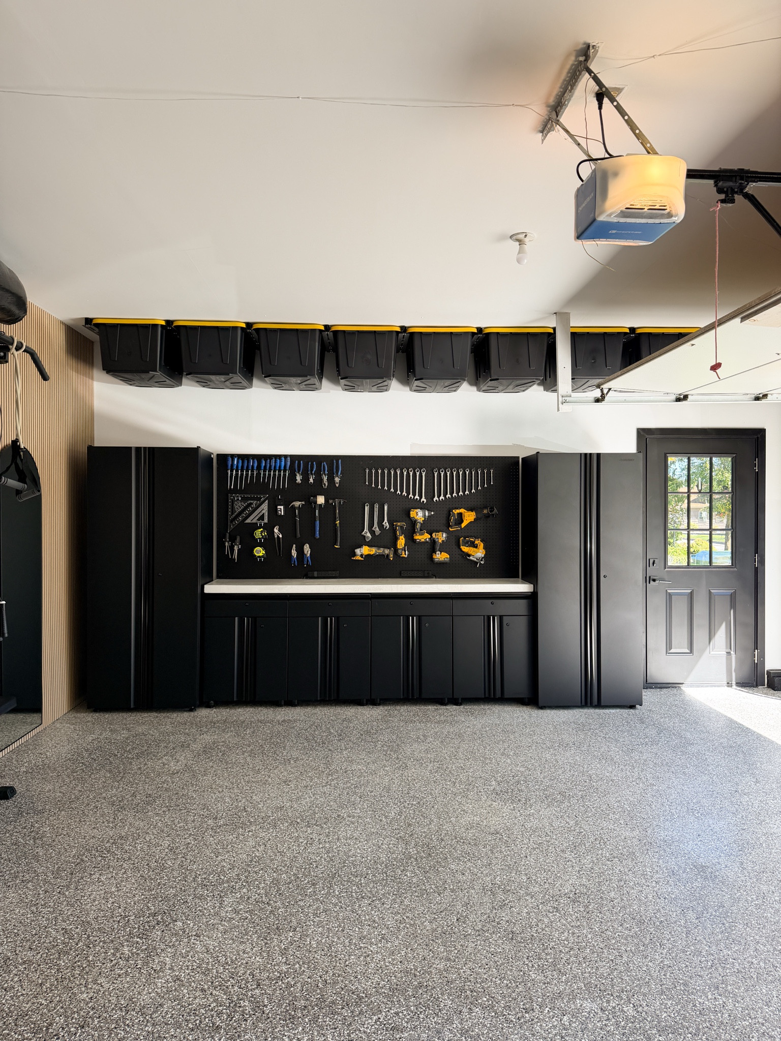 DIY home garage makeover! It feels so clean & put together now that we organized everything into storage bins + cabinets, & did our own floor epoxy! 

#Garagehomemakeover