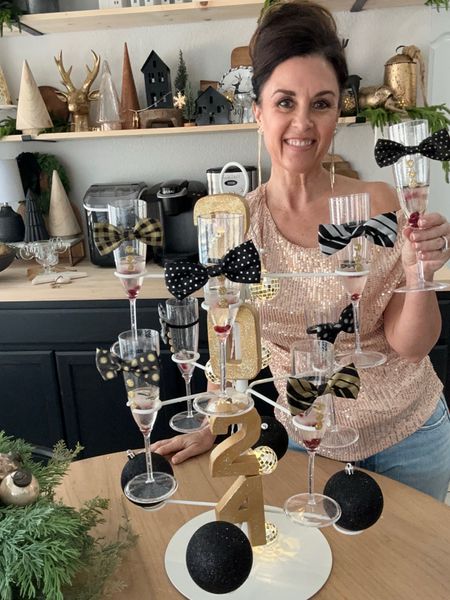 Celebrate NYE in style with this fun champagne stand and decorated with embellished champagne glasses, disco lights and fancy ice cubes 

#LTKSeasonal #LTKHoliday #LTKparties