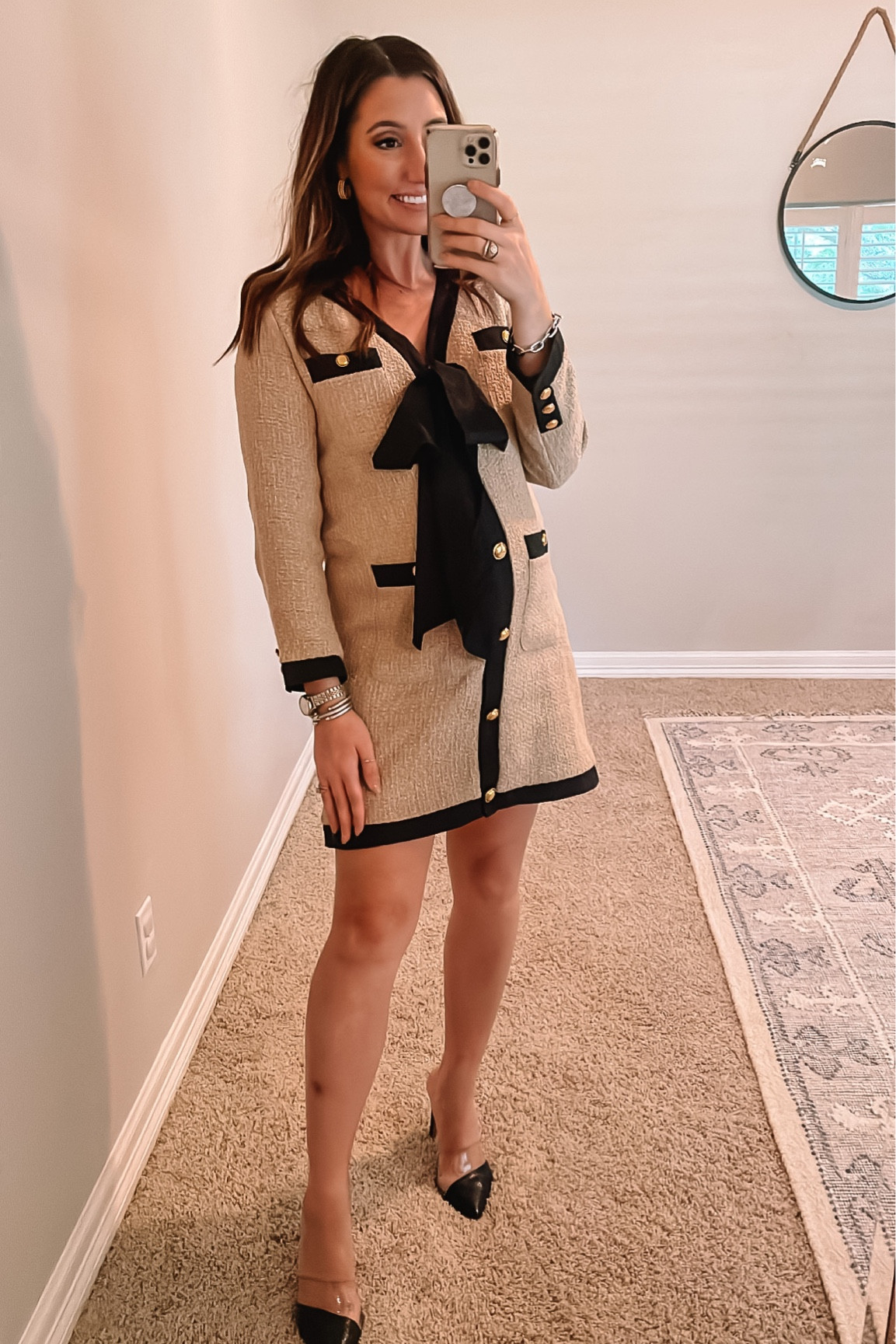 Tan tweed work dress with black front bow 

#LTKstyletip #LTKworkwear #LTKbump