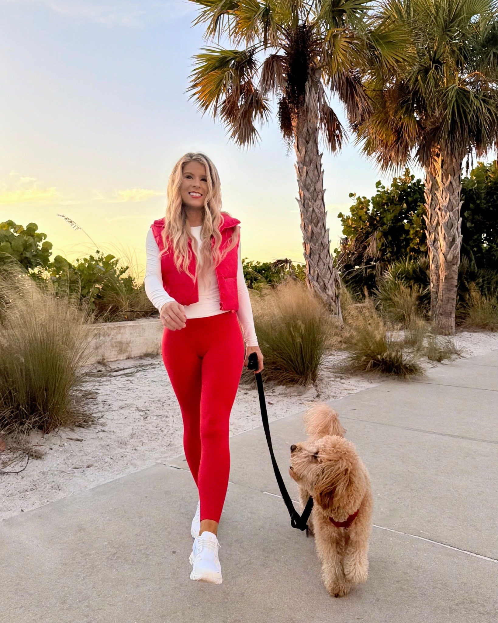 Trendy winter Activewear Outfit! I styled this athleisurewear outfit with bright red high waisted leggings, an activewear long sleeve top, comfortable white sneakers, and a cropped red puffer vest. This bright red activewear outfit makes the perfect work out outfit, easy everyday outfit, casual winter outfit, or travel outfit. 

Red leggings, highrise leggings, running, sneakers, walking, sneakers, winter outfit

#LTKActive #LTKTravel #LTKootd