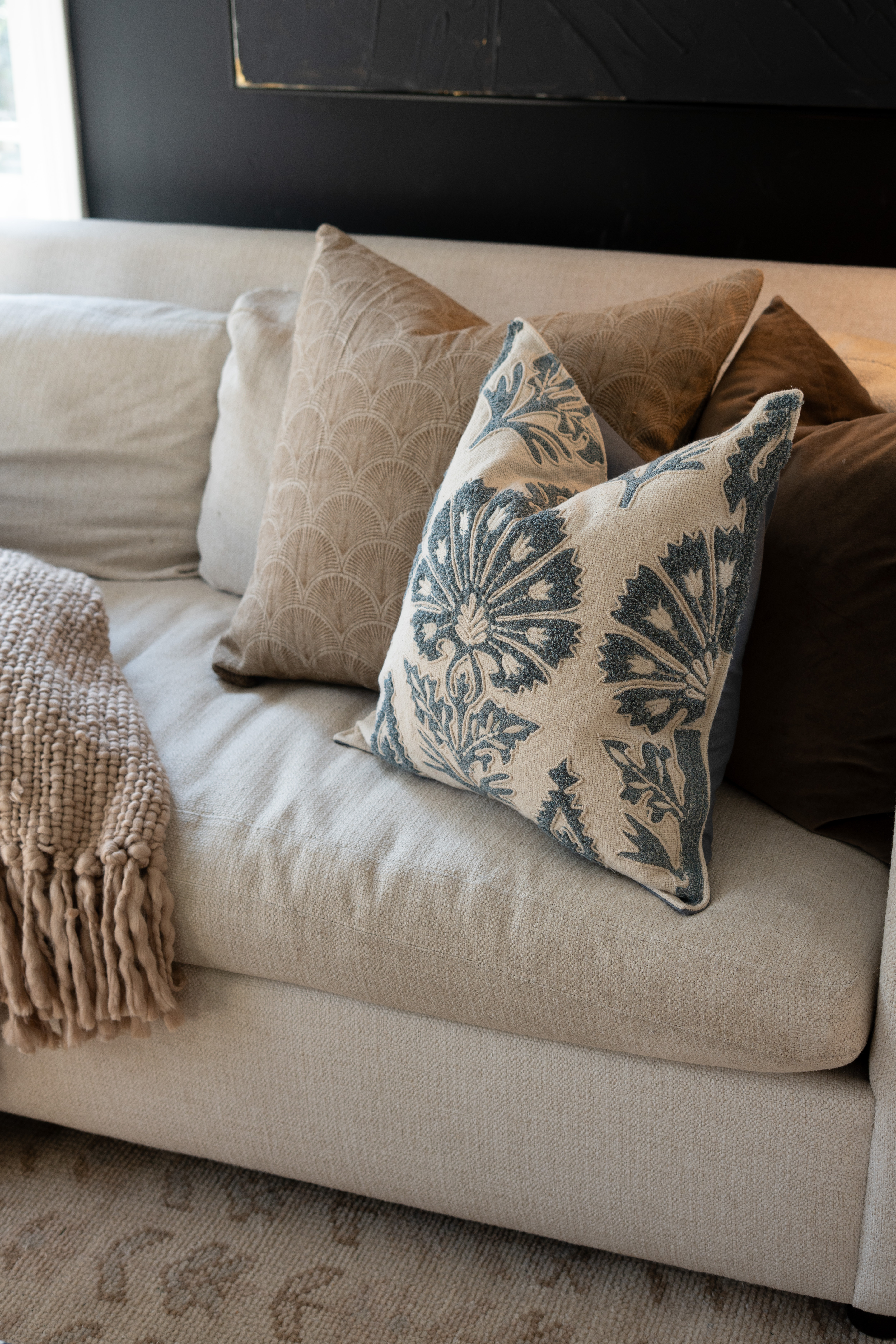 You guys I’m completely obsessed with this sofa setup. The chunky knit throw, soft neutral couch, and blue patterned pillow create the perfect cozy living room moment. It feels warm, relaxed, and so beautifully layered. 

 #LTKSpringSale #LTKSeasonal #LTKHome