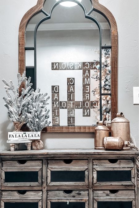 Christmas entryway decor

Trees/ cabinet are hobby lobby
Bells from amazon
Mirror is old from kirklands
Scrabble letters were a diy

#LTKHoliday #LTKSeasonal #LTKhome