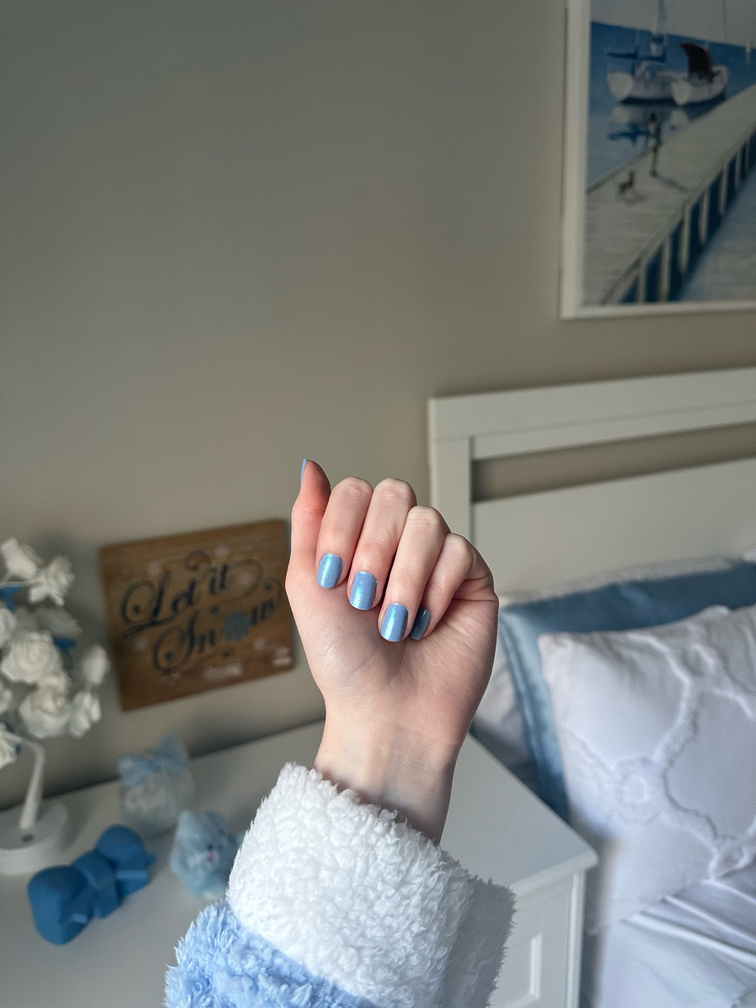 Winter manicure featuring Olive and June Shades of Seersucker with a mermaid effect top coat for a shimmering blue finish.

#LTKBeauty #LTKFindsUnder50 #LTKStyleTip