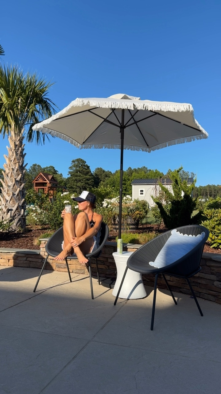 its cocktail o’clock 🍸 | we have had this open space on our porch that I knew needed a cute sitting area, it has the perfect view of the sunset + pool 🌅 

found the chairs at @homegoods for $50 a piece
cutest fringe umbrella on sale for $39! @walmart 

I must say I think it’s the perfect sunset cocktail spot ✨ save + share for backyard inspo 🫶🏼
#backyarddesign #outdoorliving #outdoorfurniture #sunset #backyardgarden #homegoods #walmarthome #outdoordesign #fridaynight 

#LTKxWalmart #LTKSummerSales #LTKHome