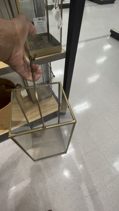 Metal and glass pillar candle lantern
Square shape
Metal construction with antique finish
Floor and tabletop placemat

#LTKhome #LTKFind #LTKSeasonal