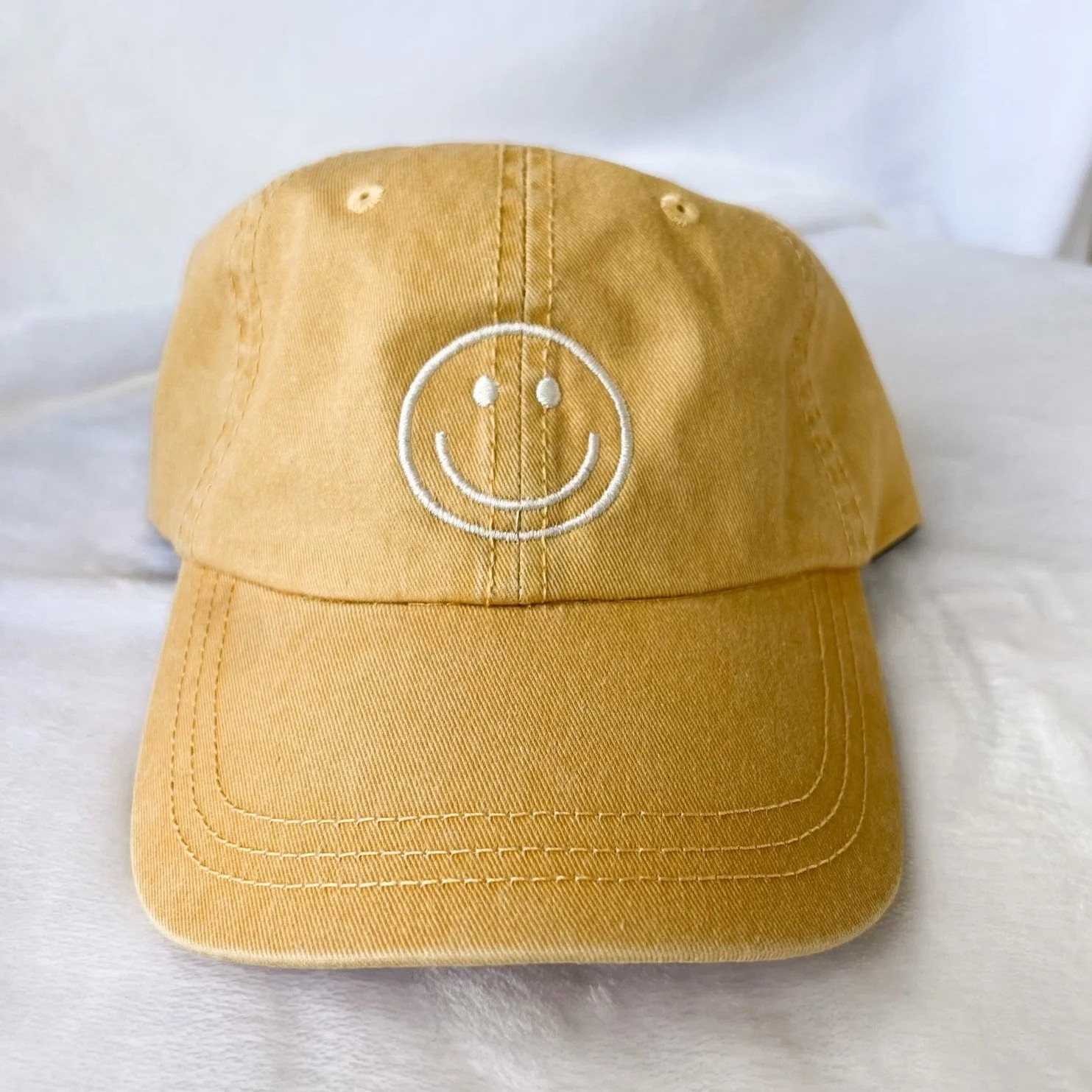 smiley face hat | yellow | Reef rain aria