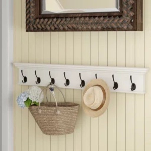 This wall-mounted coat rack from Wayfair feels like one of those small entryway upgrades that makes the whole space look more finished. The white wood shelf gives you a spot for framed art or a little vase, while the 8 black hooks underneath keep coats, bags, scarves, and towels easy to grab. I like how it adds storage without taking up any floor space, especially in a hallway or mudroom. It’s included in Wayfair’s Labor Day Deal right now