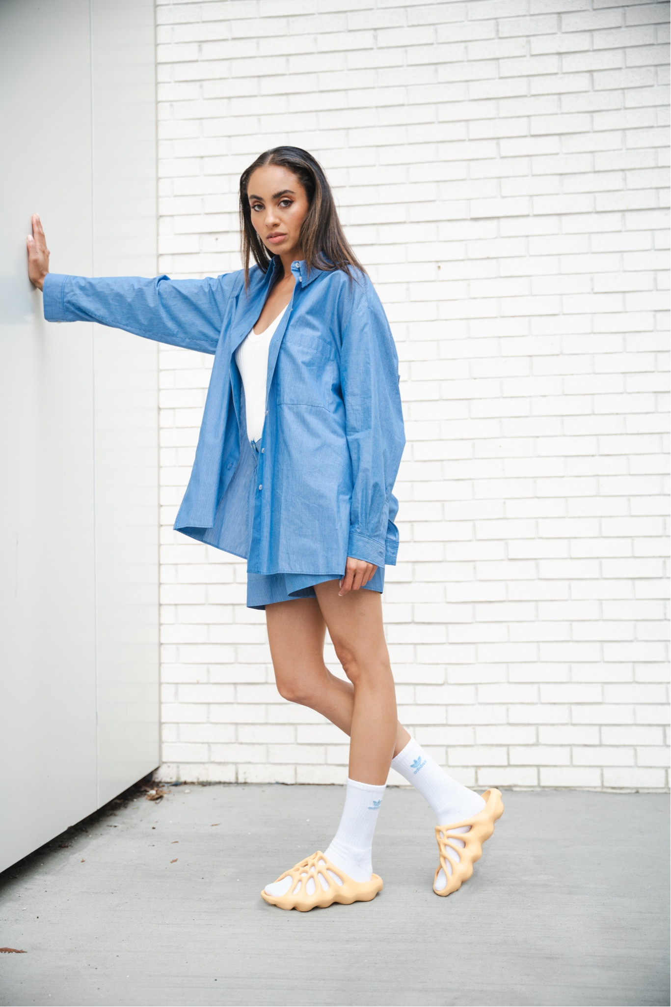 Just because the shoes look wacky to most doesn’t mean the fit has to be.  The Yeezy Slide 450, like the original Yeezy Slide before it is a polarizing piece of foam footwear designed to grab your attention with its futuristic aspirations.  Being an orange hue, I contrasted here with an oversized blue button down.  

#yeezy #yeezyslide #yeezy450 #sneakers #casual

#LTKstyletip #LTKSeasonal #LTKshoecrush