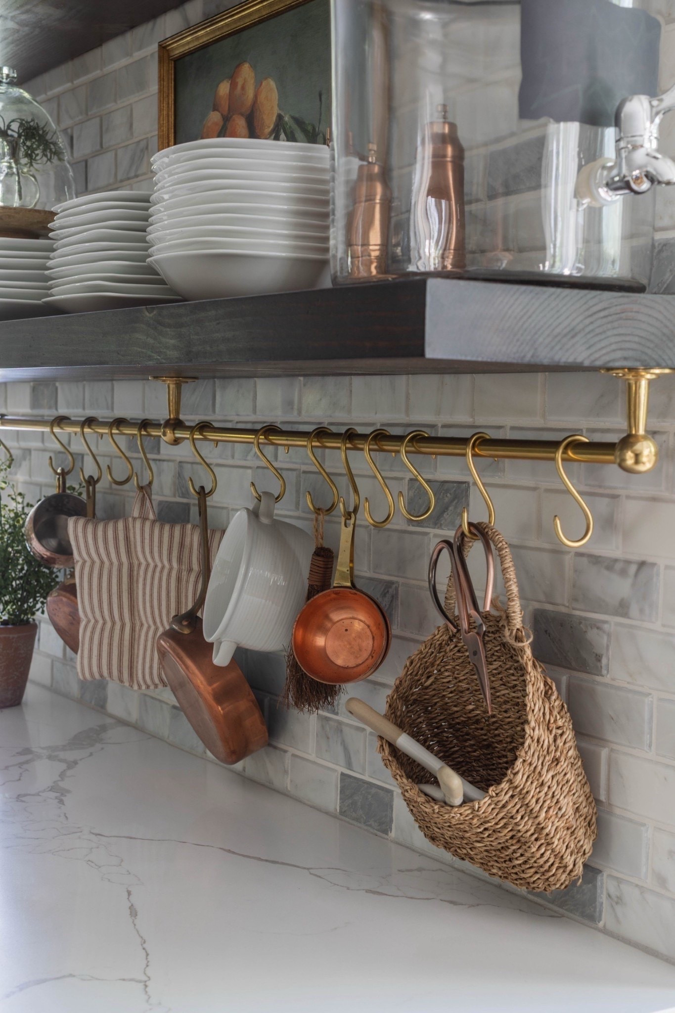Timeless and layered 🌿 This kitchen showcases white shaker cabinetry, a stainless steel cooktop, and marble countertops against a stunning marble subway tile backsplash. Framed artwork adds character, while a ceramic utensil crock with wooden spoons and a small ceramic bell complete the styled look. 🤍

#KitchenGoals #ClassicKitchen #WhiteCabinets #MarbleTile #CountertopStyle #GasCooktopDesign #CeramicUtensilHolder #WoodenSpoons #WallArtDecor #eanesinteriors



#LTKHome #LTKdayinmylife #LTKFindsUnder100