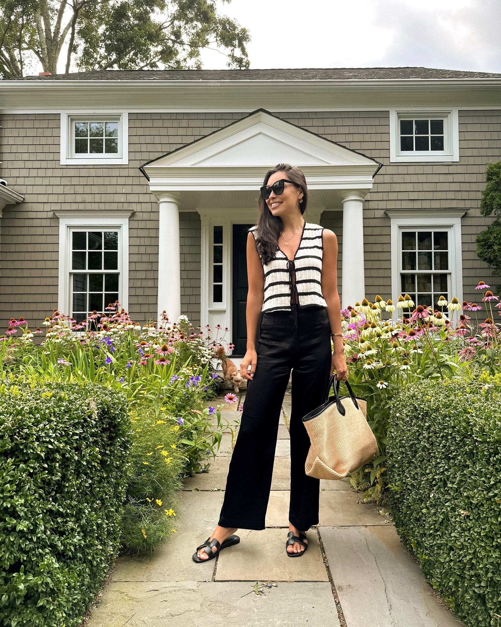 Kat Jamieson wears a Mango top and silk trousers with a Khaite tote bag. 

#LTKitbag