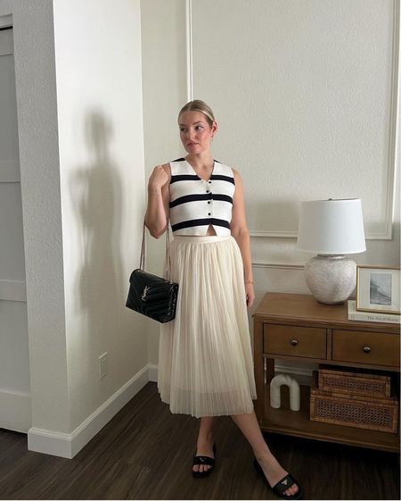 Pleated white midi skirt, striped vest, timeless style
