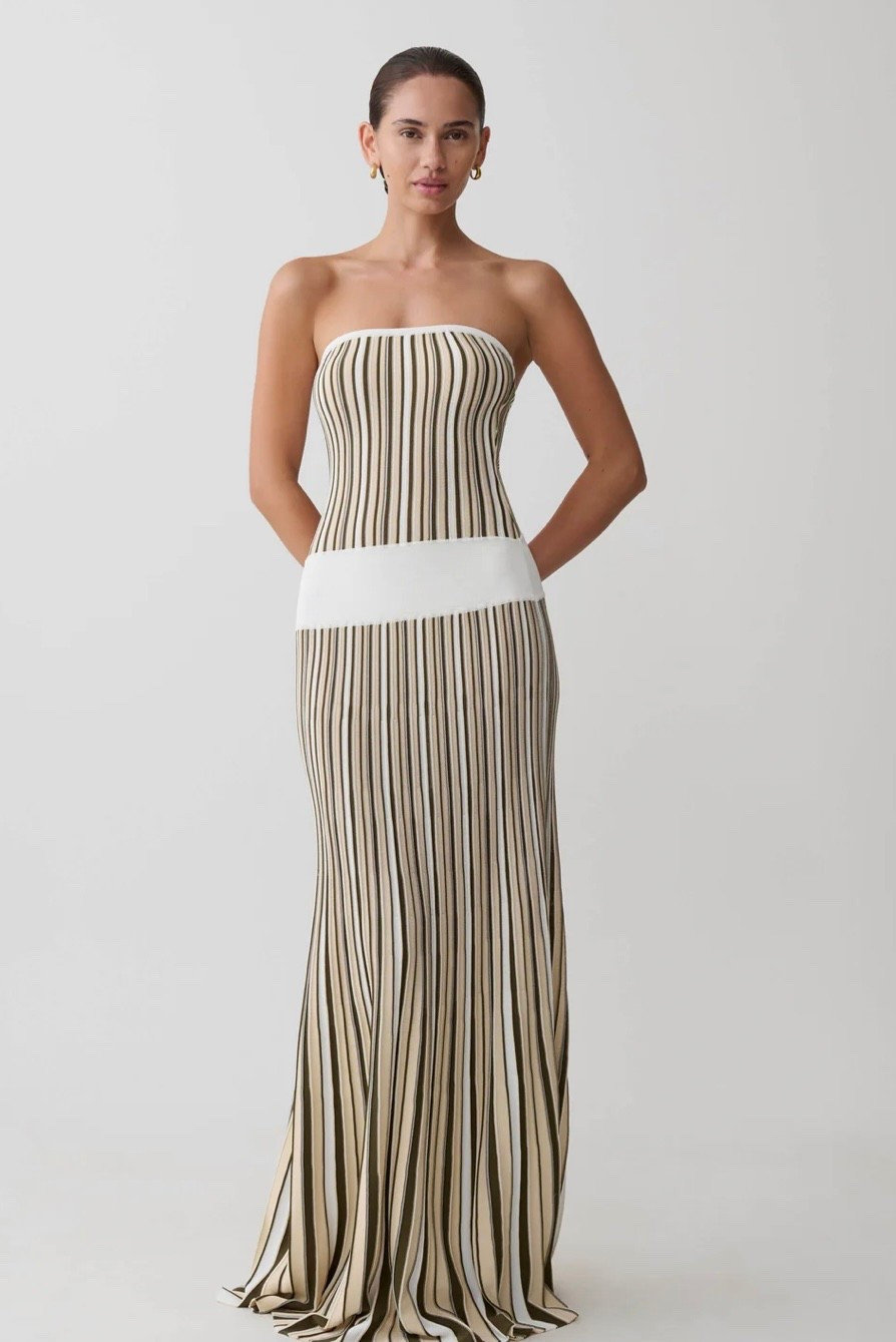 Chic Style. Slight Stretch: 80% Viscose, 20% Polyamide   The JOYCE Stripe Maxi Knit Dress combines texture and structure in a striking strapless silhouette. Designed with a contrast bust and hip panel, it defines the shape before flowing into a pleated maxi skirt that adds soft movement. The textured striped knit brings depth and visual interest, balancing the fitted upper with a fluid finish. Cut to a full maxi length and left unlined for a lightweight feel, this dress delivers modern impact with effortless ease.

#LTKPlusSize #LTKSaleAlert #LTKMidsize
