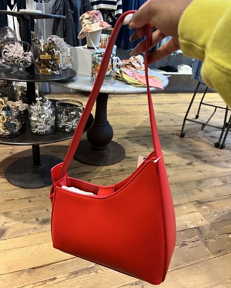 I love this bag! She’s minimal but the red color makes it interesting.
Anthropologie The Noemi Asymmetrical Buckle Shoulder Bag

#LTKitbag #LTKSeasonal