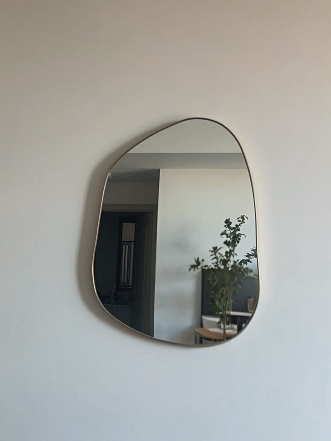 Asymmetrical cloud shaped frameless wall mirror that dresses up an empty small wall in a entryway, foyer, hallway, bathroom or bedroom. All sizes and prices linked.

#LTKSaleAlert #LTKHome