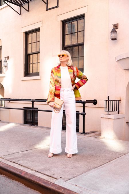 A fun dose of color thanks to this psychedelic blazer 🔮 sunglasses are Nanushka! Size down in the jeans - they run big. 

#LTKSeasonal #LTKstyletip #LTKshoecrush