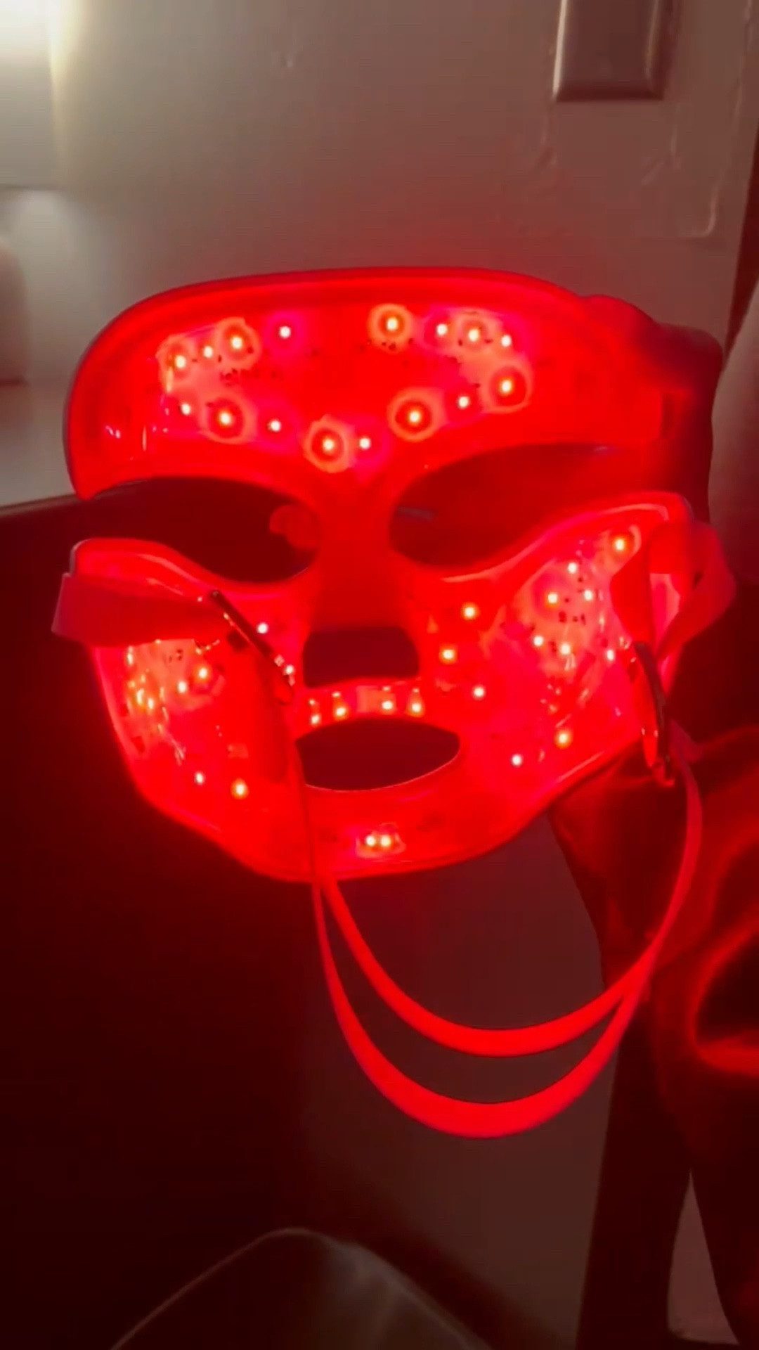 This Red Light Mask has been everything!! I use it mostly on red light. My college student uses it on blue/red light for cystic acne. My younger teen uses it on blue light for acne and we absolutely love it! We have seen great improvements especially with the girls acne! Must use consistently for best results but I’m telling you, if you need something for acne.. this is your girl! The red light is a plus for me. I’ll sit and read with it on for some self care time. It’s rechargeable so no annoying cord. Battery lasts a long time and everyone in the family can use it. I also use it on my neck just flip it upside down and now it’s a neck red light! #acne #redlightmask #redlightbenefits #acneproneskin #hormonalacne #bluelightmask 

#LTKSaleAlert #LTKselfcare #LTKCyberWeek