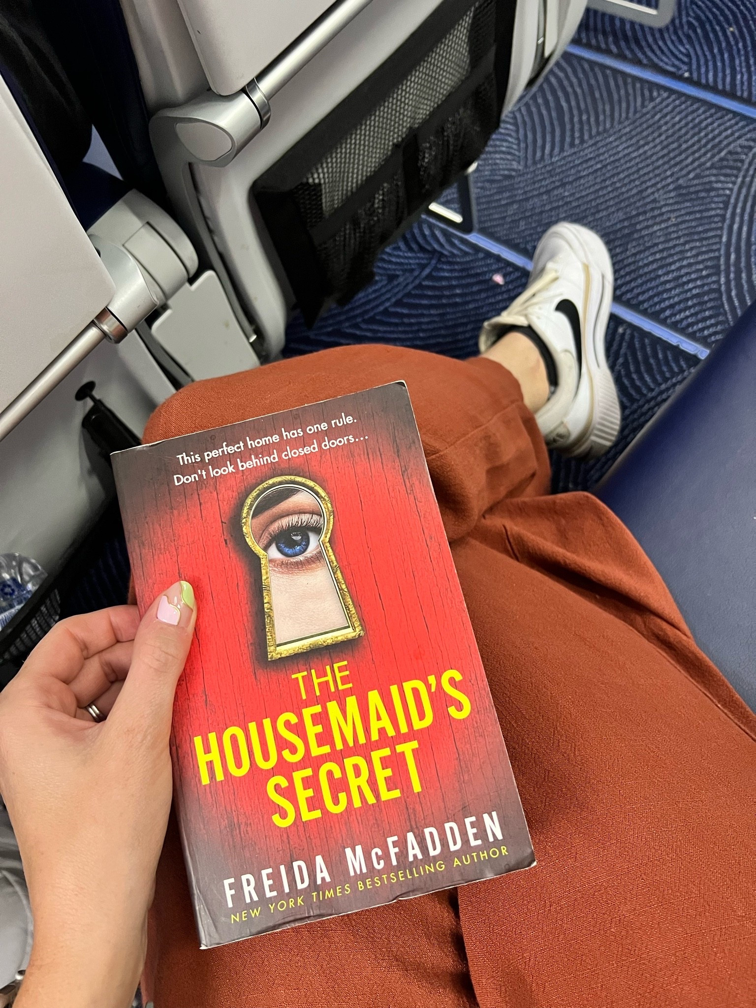 Flight essentials: a new book, gym shoes, comfy pants, and a sweatshirt.

#LTKTravel