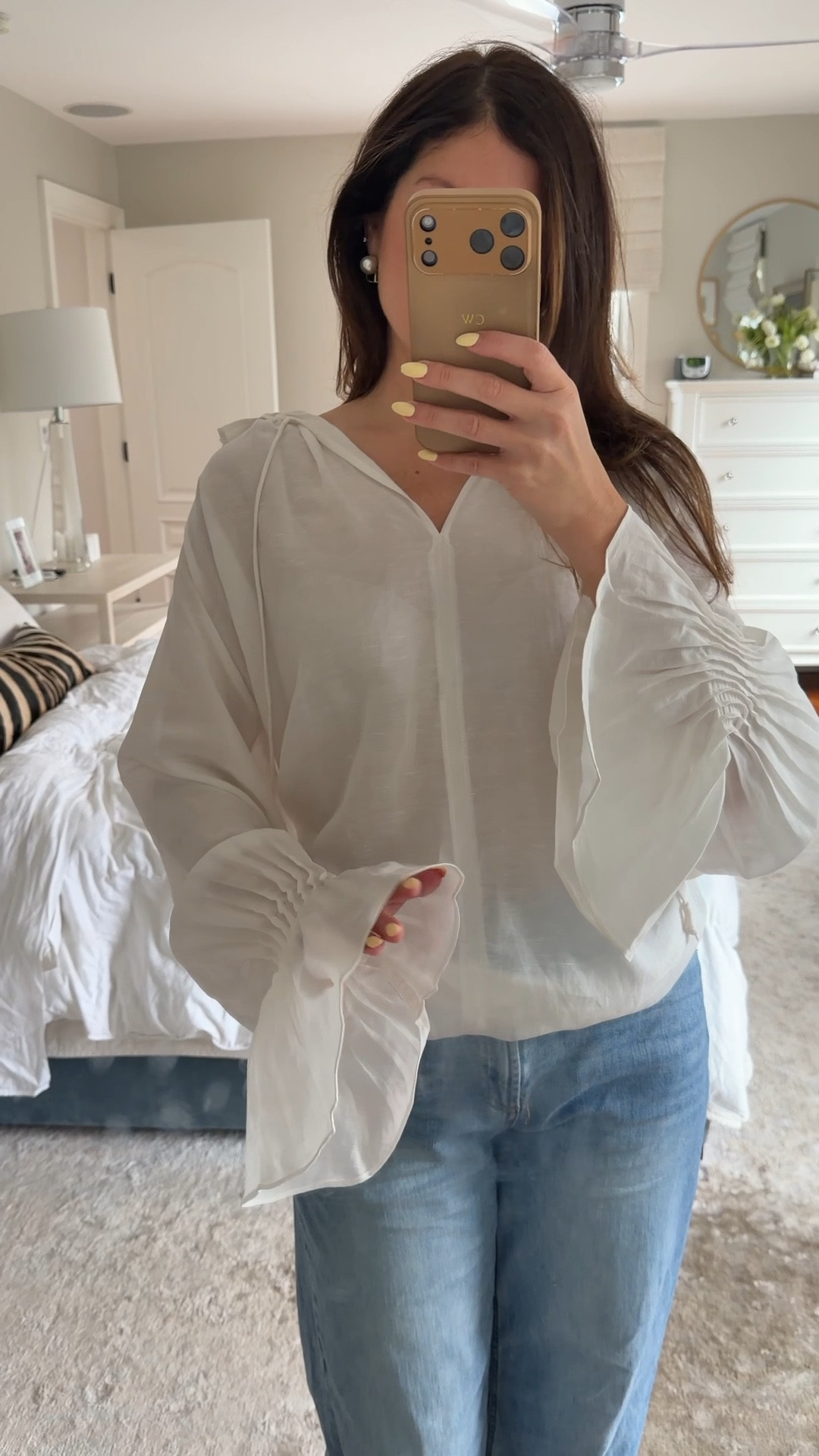 This top is so beautiful. It runs very oversized. I’m wearing a small here. Bell sleeves, look for less, white, spring, summer, outfit idea.

#LTKootd #LTKWorkwear