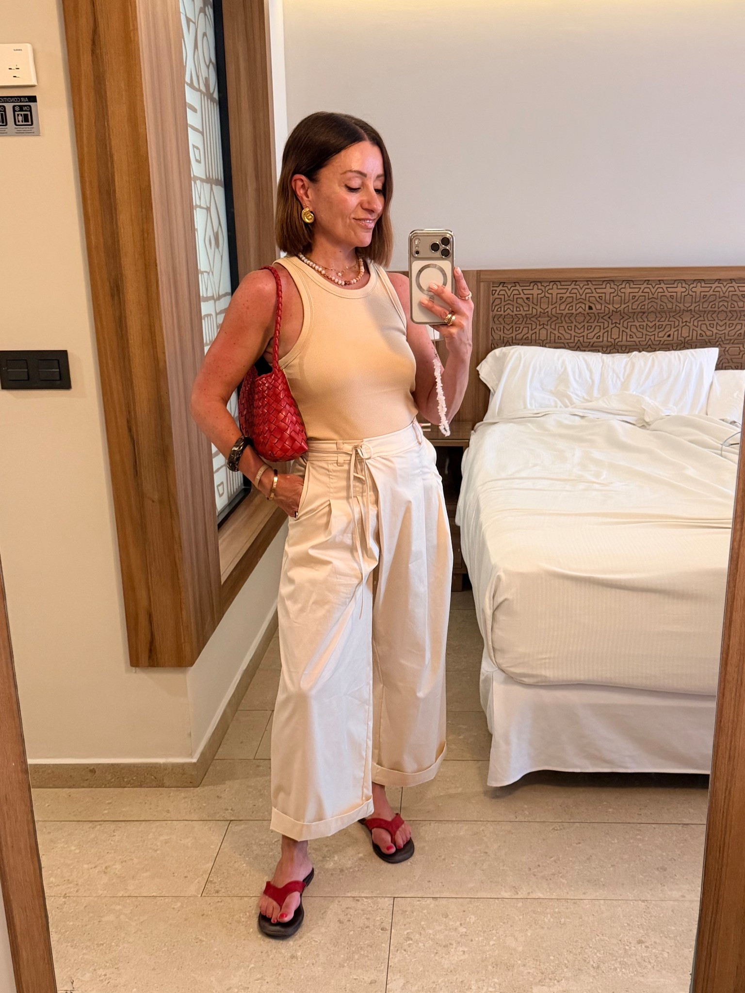 These trousers aren’t just for petites, but here’s how I’ve styled them if you are. 

I wore these on holiday last week and know I’ll wear the a lot this spring/summer too. They’re that lightweight, easy piece that just work. 

I went for the extra short leg which sat a little awkwardly at the ankle, so I’ve cuffed them once. Doing this shows a bit of ankle which stops them from drowning my frame. You could absolutely wear them long though too. 

The button and tie waist detail is everything, and I’ve styled them tonally here which is my forever formula.

#LTKsummer #LTKspring #LTKuk
