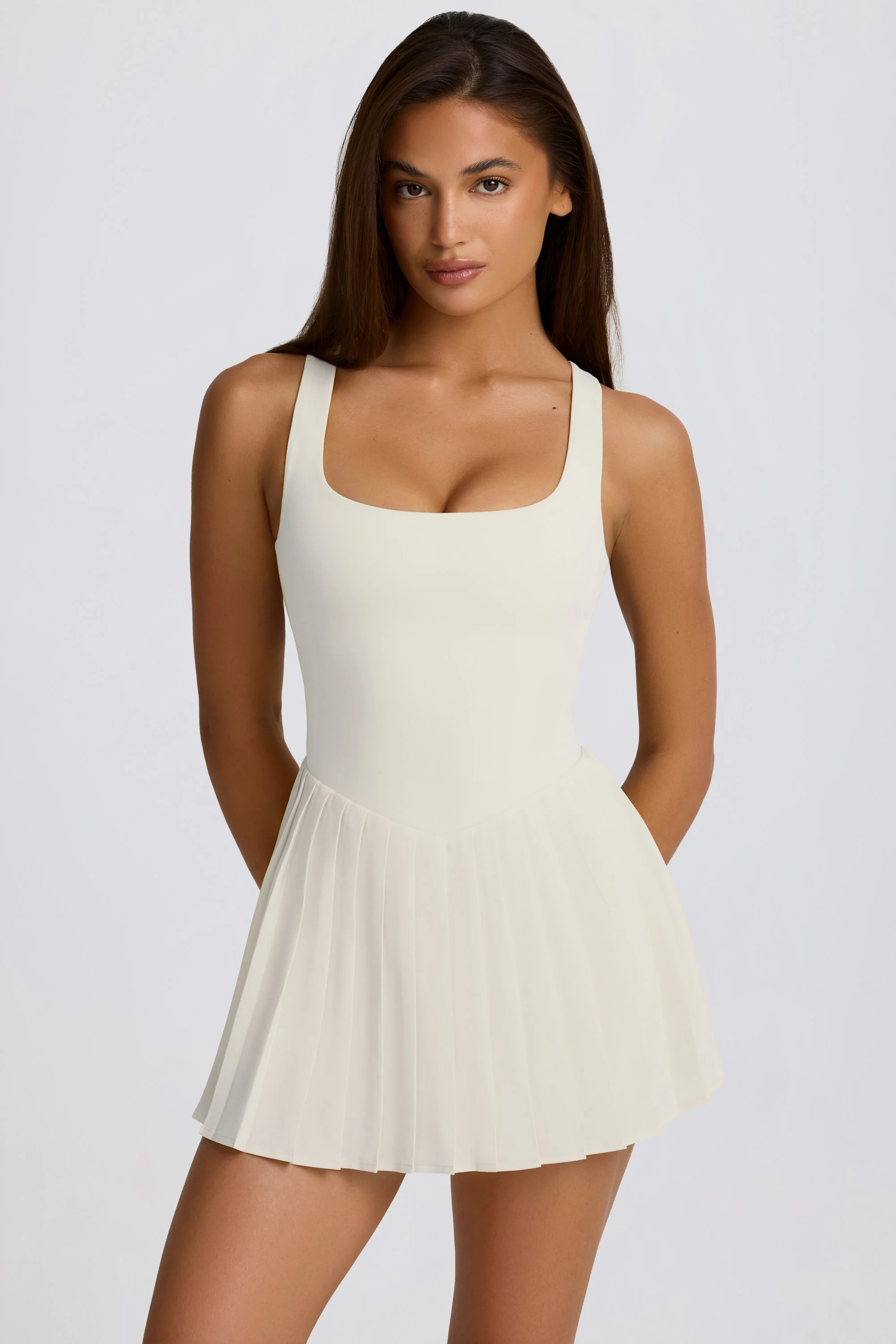 Soft Active Open-Back Pleated Tennis Dress in Ivory | Oh Polly