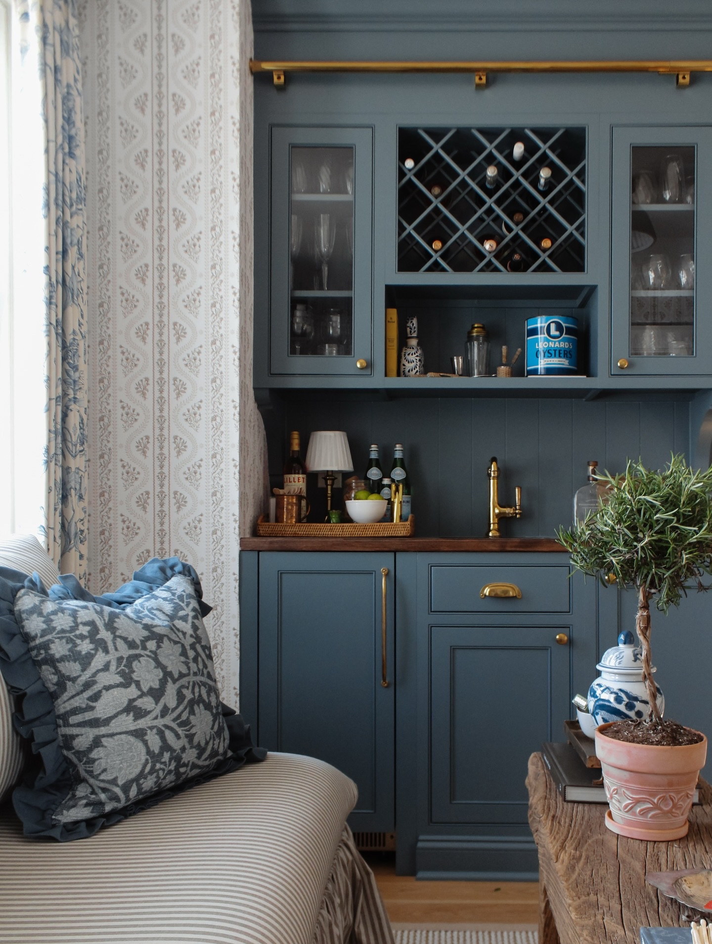 Welcome to the sitting room: once-forgotten corner that’s now the heart of our home. ✨

From the first week we moved in, we knew this space would be the perfect extension of the kitchen and the spot everyone naturally gravitates toward when we host.

And what makes that happen? A bar, of course. If you’ve been here, you know we originally had bookshelves and painted them this stunning @benjaminmoore blue. I’m so glad we kept the blue for this cabinetry, the tone it sets is everything. Choosing every fixture, sourcing antiques that mean the world to us, and layering in all our favorite textures was such a rewarding mix of perfectly imperfect.

Want to shop the space? Just comment SIT and I’ll send everything straight to your inbox 🤍

#sittingroomdecor #homebar #sittingroomdesign #sittingroomdesign #holidayhosting #blueinteriors #coastalcottage #nancymeyersaesthetic