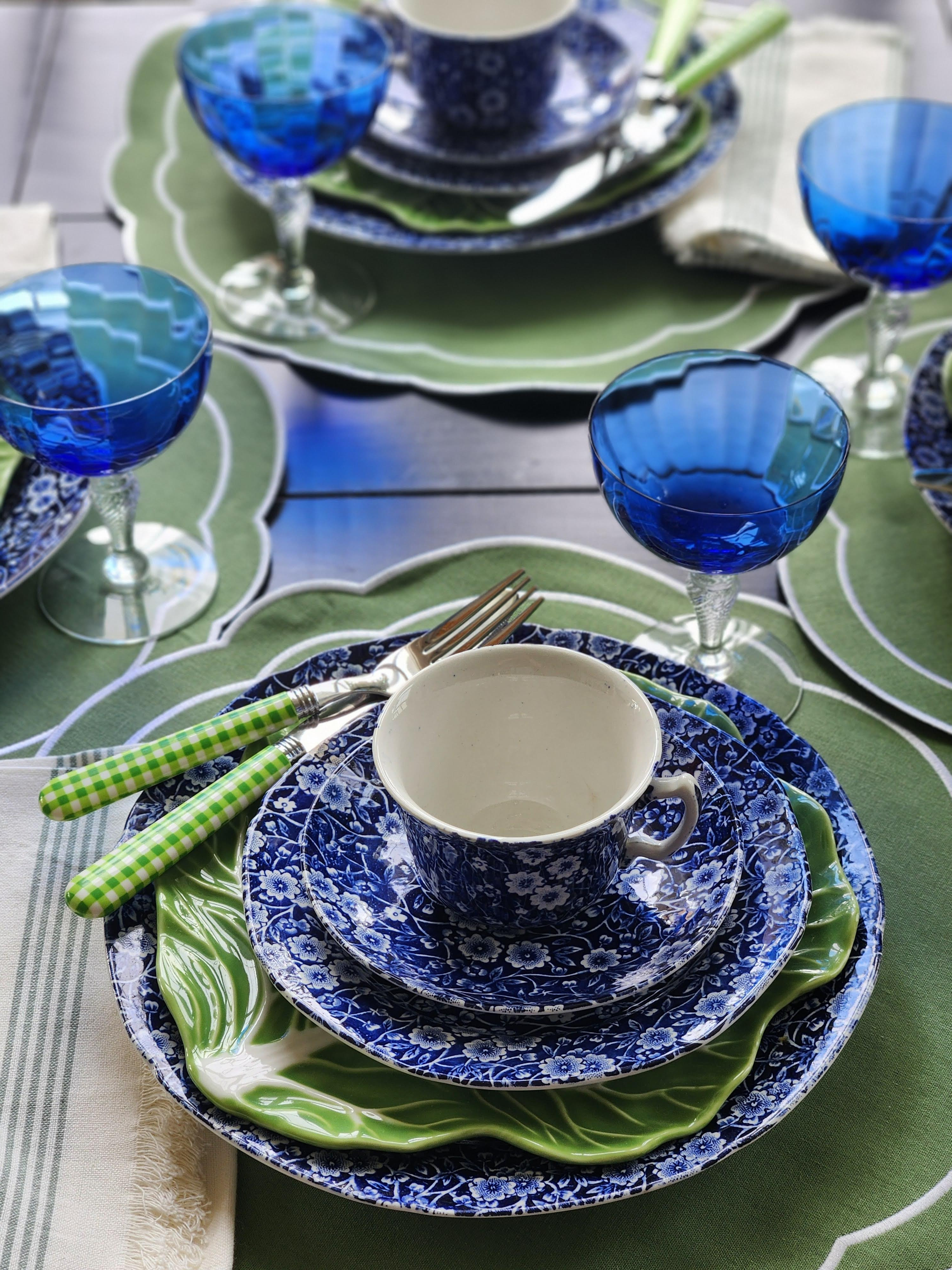 This color combination is giving me ALL the feelings. 💙🌿 Blue and green together at the table — it just works.
I've been obsessing over this tablescape and honestly it might be one of my favorites I've ever put together. We've got my blue and white Calico dishes stacked on the prettiest green cabbage leaf salad plates, cobalt blue stemware that catches the light like crazy, and those green gingham handled flatware pieces from Annova that I cannot stop buying in every color.
This is exactly the kind of table that makes an ordinary Tuesday feel like a garden party. And isn't that the whole point? 🌿
Everything is linked right here on LTK — shop the full look!
✔️ Blue and white tablescape
✔️ Calico dishes
✔️ Green cabbage leaf plates
✔️ Cobalt blue stemware
✔️ Gingham flatware
✔️ French country table setting
✔️ Spring tablescape ideas
✔️ Vintage inspired entertaining

 

 #LTKHome
