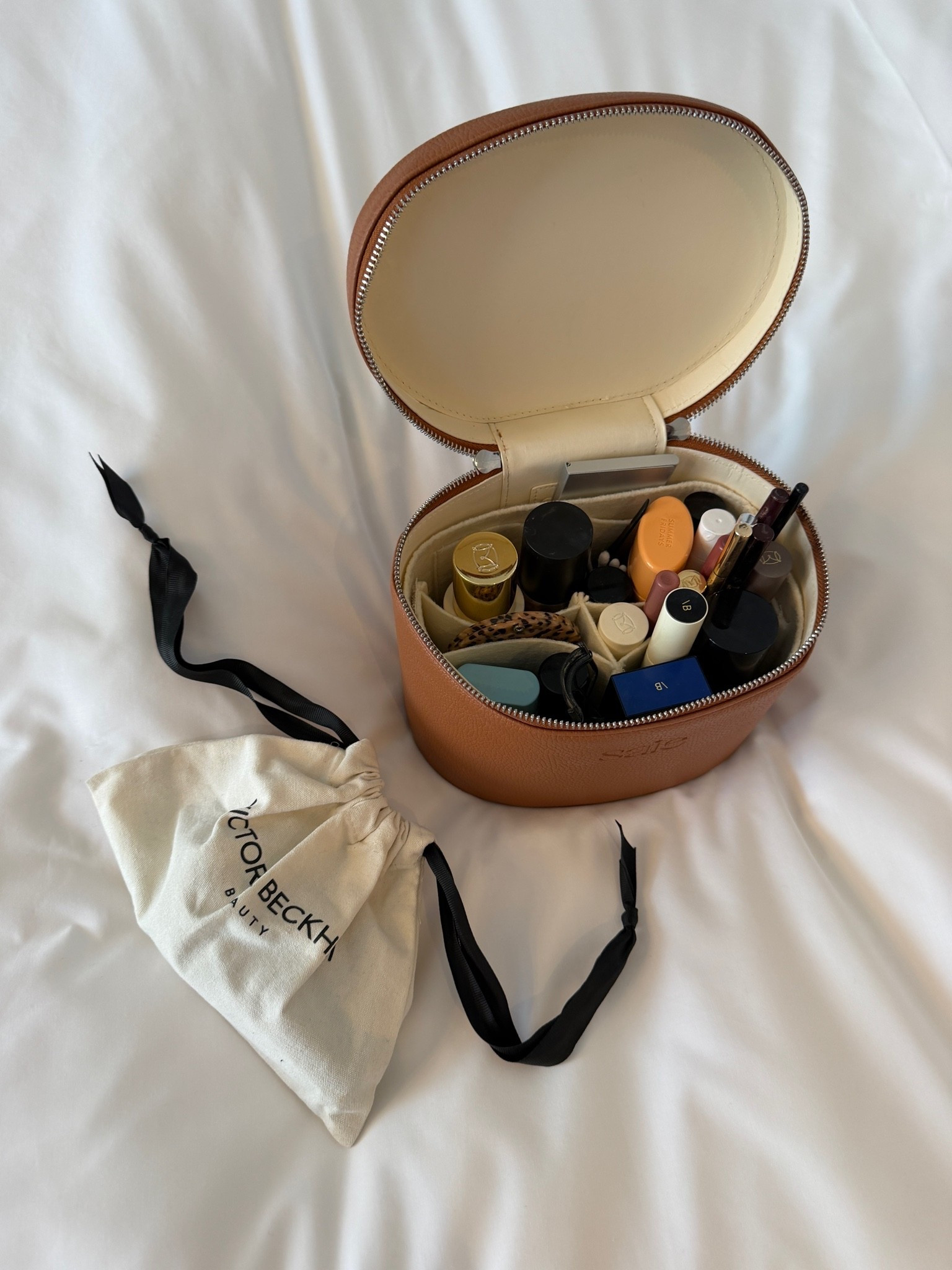tan leather vanity case, oval makeup train case, travel beauty organizer, Victoria Beckham Beauty, VB makeup, Summer Fridays lip balm, what’s in my makeup bag, travel beauty edit, makeup organization, vanity case with compartments, beauty essentials, ltkbeauty, ltktravel, ltkitbag, ltkfindsunder100, outfit inspo, capsule wardrobe essentials

#LTKtravel #LTKdatenight #LTKbeauty