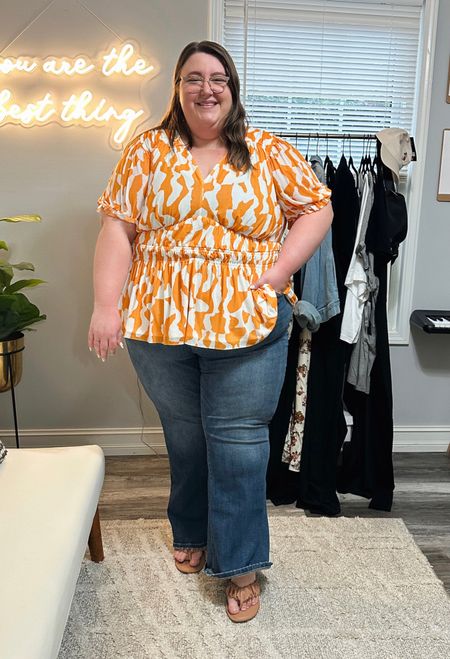 Plus Size OOTD! Caroline is wearing a top from Target in a 3X, a pair of flare jeans from Lane Bryant in a size 28, and a pair of nude sandals from Target (linked similar)

#LTKcurves #LTKstyletip #LTKSeasonal
