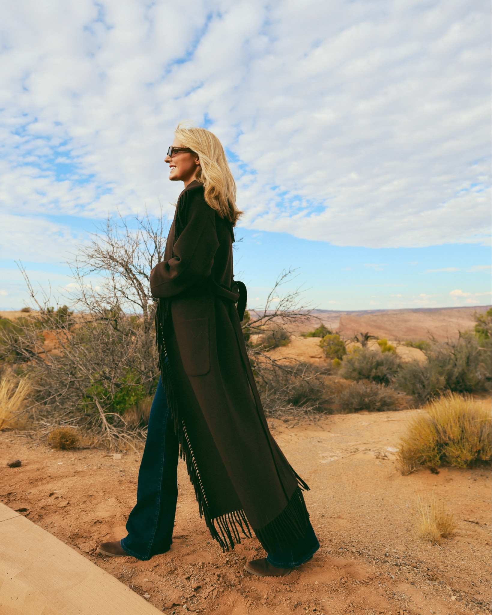 The “Carrie” coat by SIMKHAI, is one of my favorite finds of the season. It’s beautiful, elegant, and truly a standout coat that I’ll be picking up time and time again. It has fringe trim along the hem and collar of the coat which gives a subtle western flair. Both western details and the color chocolate brown are VERY on trend this season, which is just another reason to fall in love with this one.

With a longer length, tie waist, and the fringe detailing, this piece brings a little fashion drama (in the best way).

~Erin xo

#LTKSeasonal #LTKStyleTip