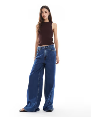 ASOS DESIGN Tall high waist wide leg jeans in midwash blue | ASOS (Global)