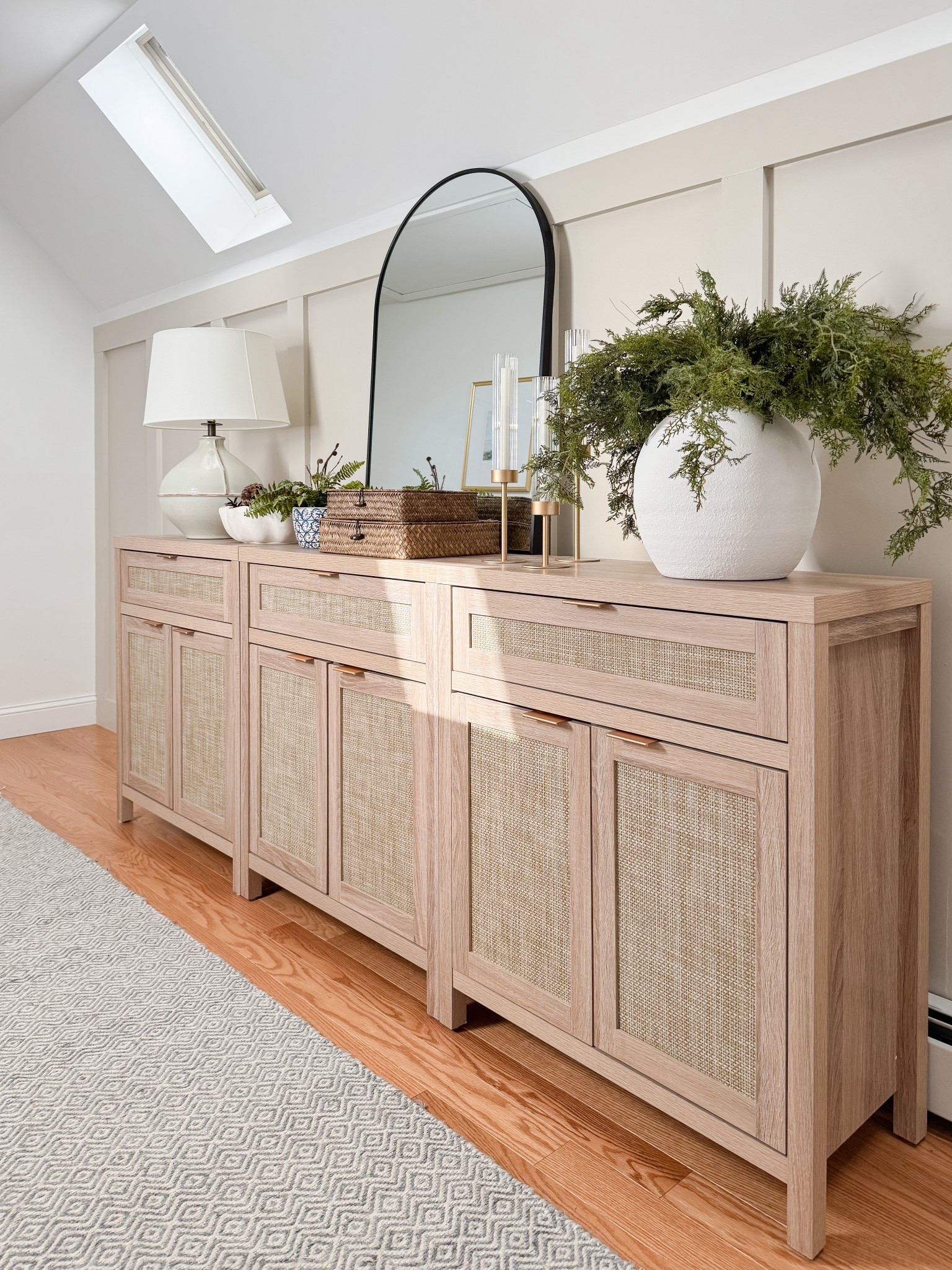 This woven sideboard adds storage and texture while elevating the entire space. coastal storage furniture, sideboard buffet, woven furniture, neutral home decor, coastal interiors, timeless furniture, home organization, living room styling, sherricalnanhome

#LTKHome #LTKFindsUnder50