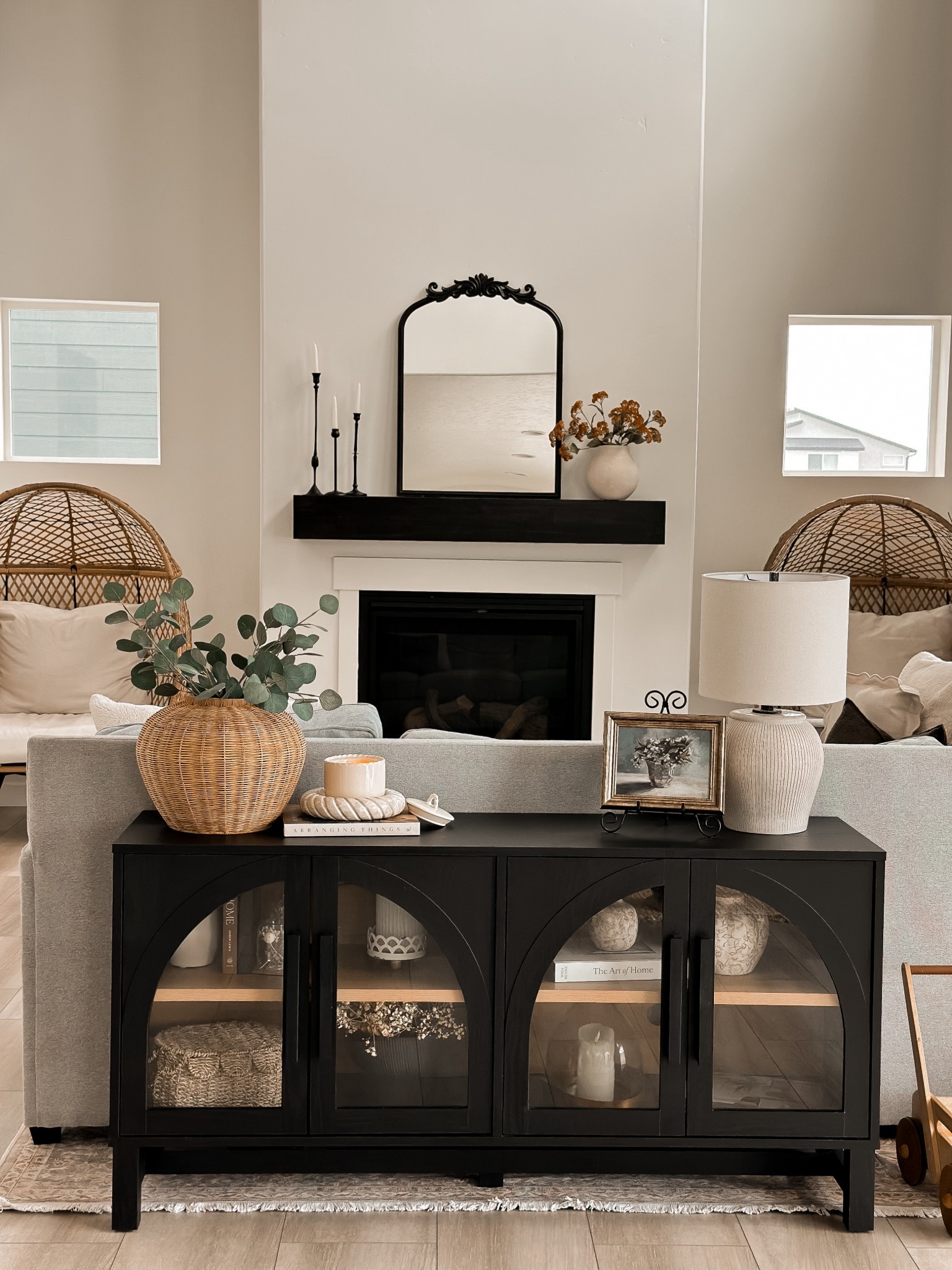Neutral Home Inspo | Cozy + Elevated Living Room Vibes 

If you’re obsessed with modern vintage farmhouse charm, warm neutrals, and budget-friendly decor finds — this one’s for you! Every piece in this space is so affordable and from retailers you already know and love 👏🏼

This black arched cabinet is an absolute steal and gives Anthro vibes for a fraction of the price
Styled with timeless neutrals — cozy candles, woven textures, and simple coffee table books
That vintage-inspired mirror + matte black taper holders = major modern Parisian energy
Wicker planter, ceramic lamp, and small framed art add those cozy collected-over-time touches
Can we talk about the egg chairs?! They’re outdoor-approved but look so chic styled indoors
Everything is linked + super budget-friendly — perfect for a living room refresh or rental styling!

Follow for daily home inspo, decor styling tips, and affordable Amazon & Target finds that look designer without the price tag 

Tap to shop + follow me on LTK so you never miss a cozy home deal drop!

#NeutralHomeDecor #ModernFarmhouseStyle #BudgetFriendlyFinds #LivingRoomInspo #ArchedCabinet #AmazonHomeFinds #TargetStyle #AnthroDupe #InteriorDesignOnABudget #CozyMinimalist #HomeStylingTips #AffordableHomeDecor #LTKhome #LTKunder100 #HomeVibes

#LTKHome #LTKStyleTip #LTKSeasonal
